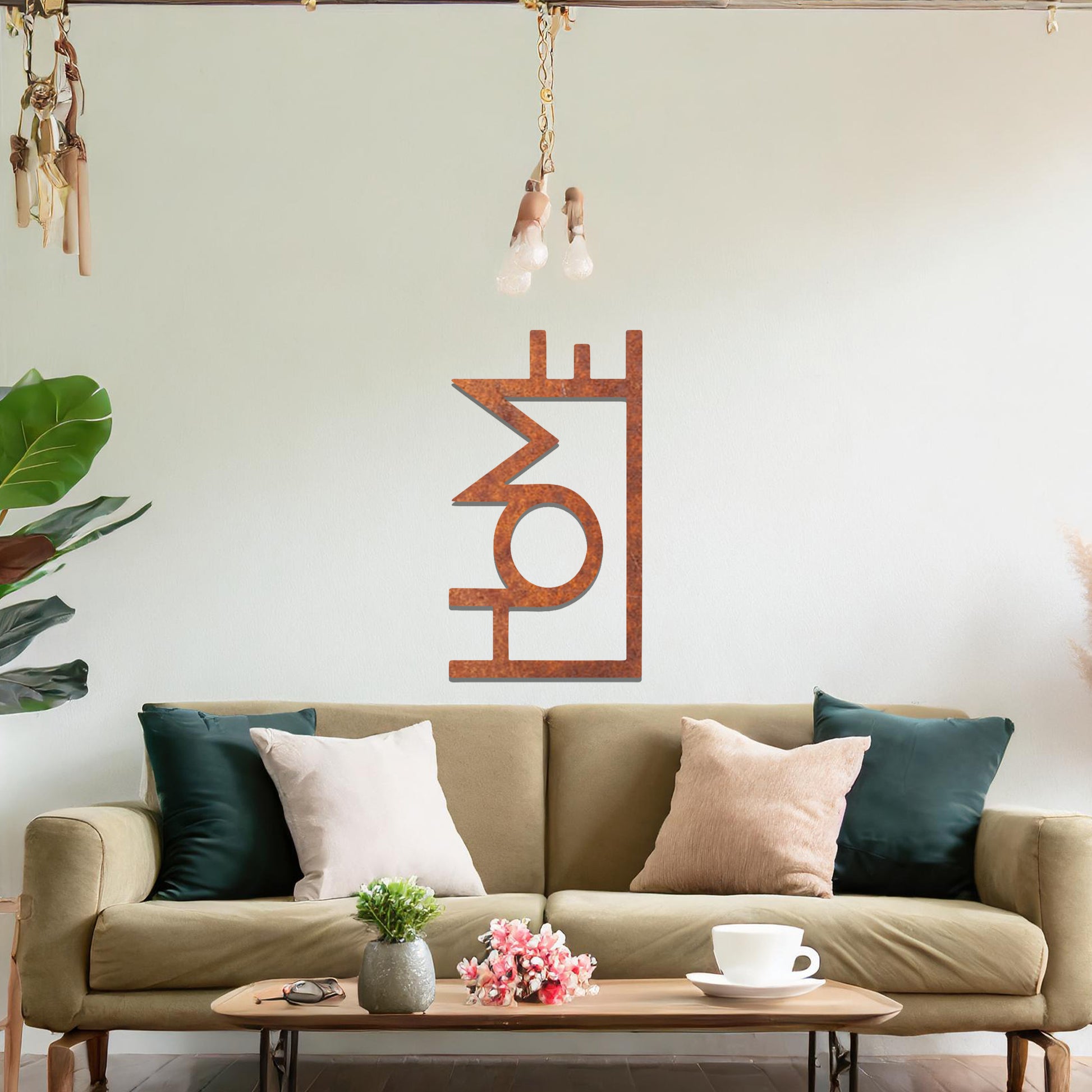 A modern metal wall art design featuring the word "HOME" in bold, geometric typography with an innovative, angular twist. The artwork is displayed on a neutral wall in a contemporary room setting.