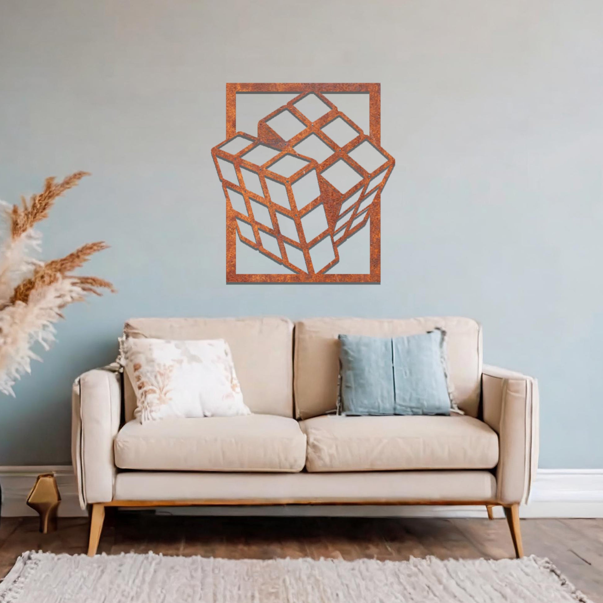 Metal wall art featuring a rectangular design of a three-dimensional cube, showcasing bold geometric shapes and a modern aesthetic as a statement piece.