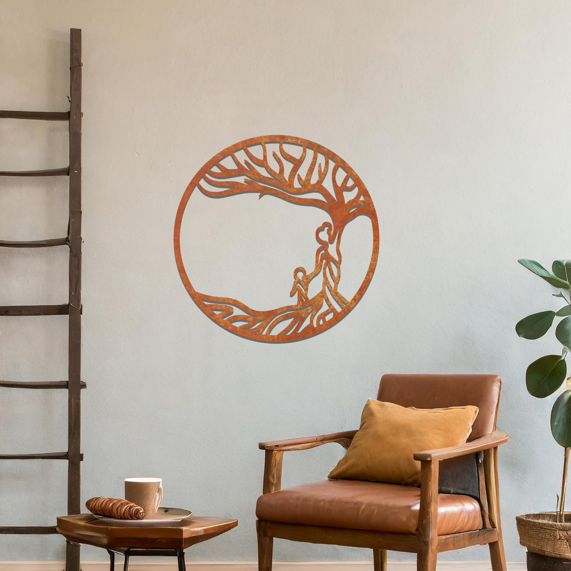 Metal wall art featuring a circular design with a symbolic tree and figures motif, depicting a parent and child under a tree with flowing branches, mounted on a neutral wall within modern room decor. The intricate design evokes warmth and connection, enhancing the aesthetic of the space.