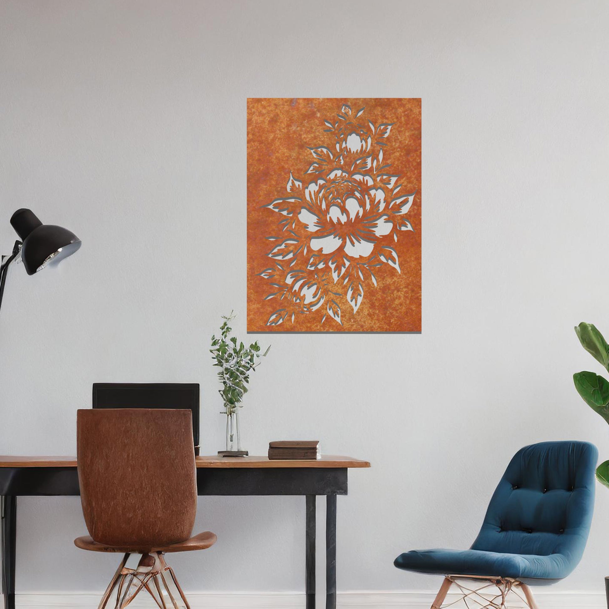 Metal wall art featuring a detailed design of a bouquet of roses, with large blossoms and intricate leaves. The design is cut-out, capturing the delicate petals and curves of the flowers. The artwork is displayed against a neutral wall within a modern interior.