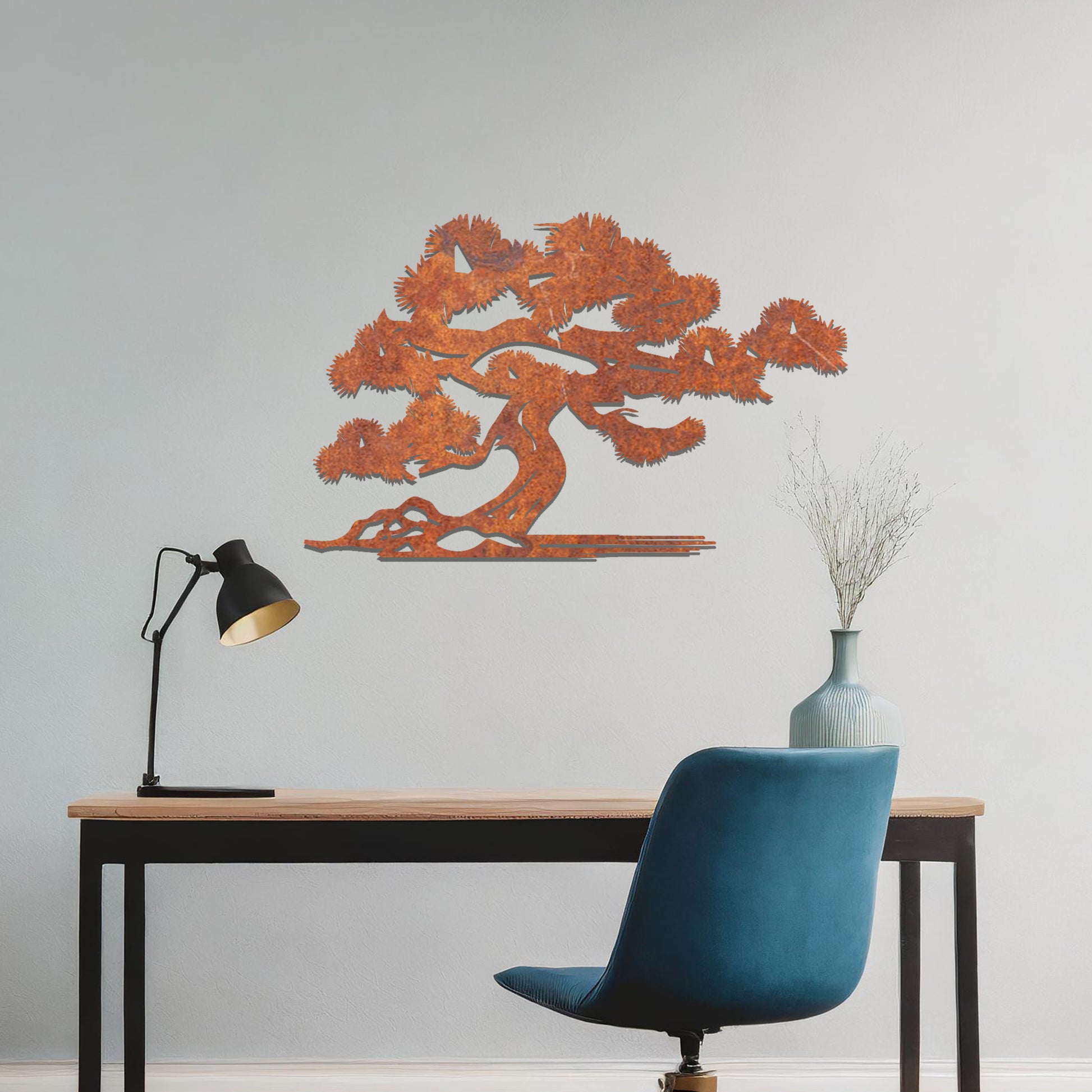 Metal wall art showcasing a serene bonsai tree design with flowing branches and a textured trunk, adding an artistic and calming element to the living space.