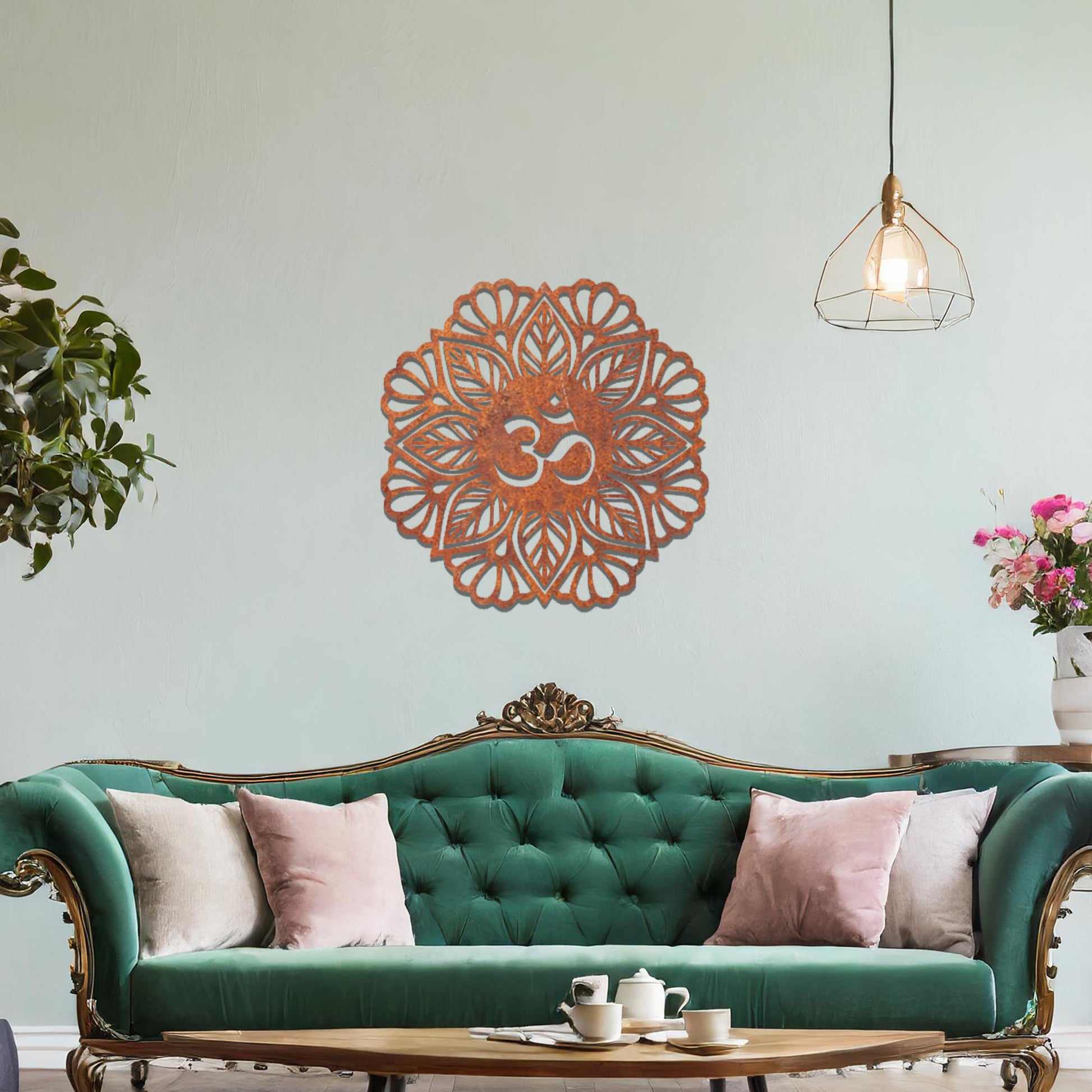 Metal wall art featuring an intricate mandala design with the Om symbol at its center, mounted on a neutral wall within modern decor. The spiritual motif and detailed craftsmanship create a calming and elegant focal point.