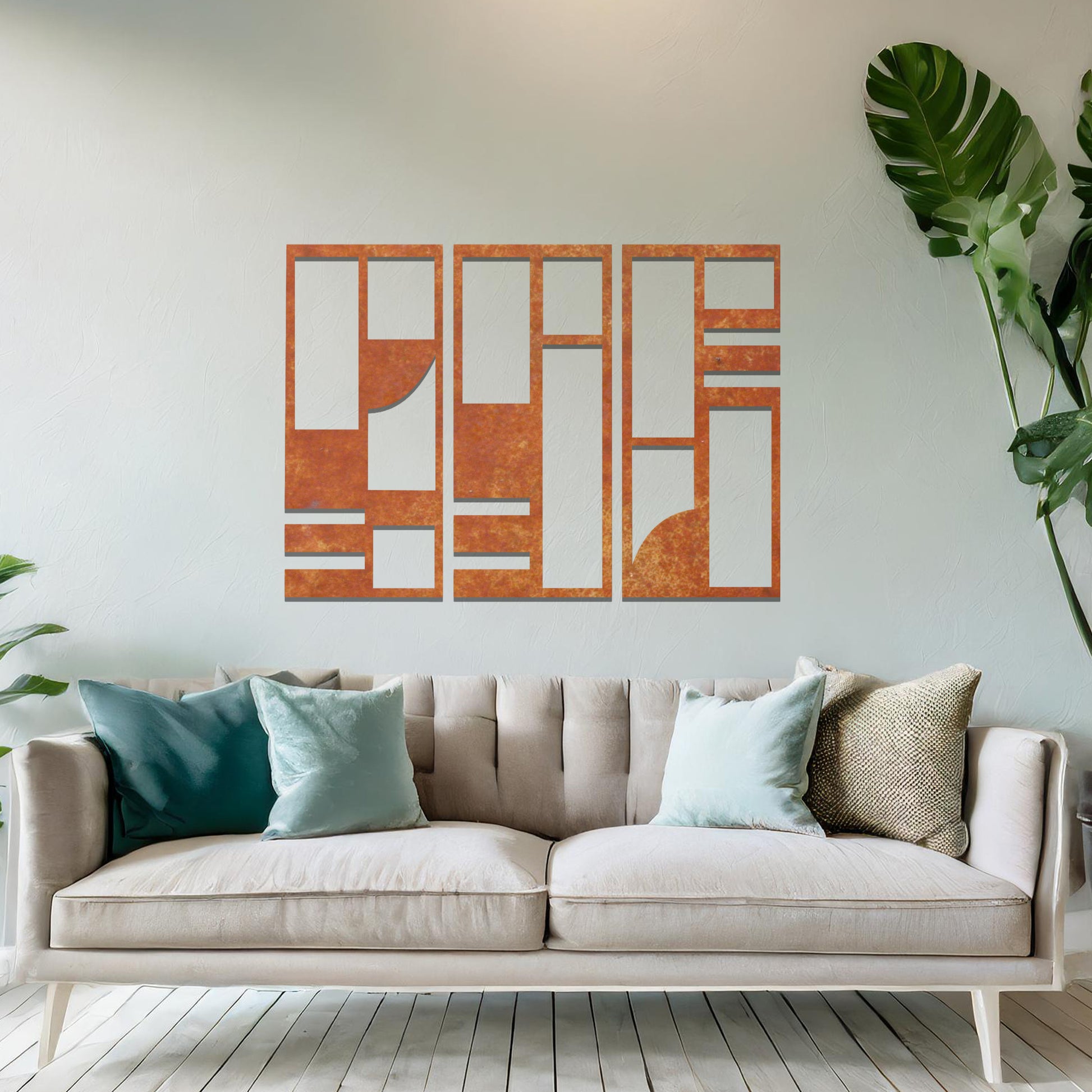 Abstract metal wall art set of three panels with geometric designs featuring rectangular and square shapes, curved lines, and clean angles. The art is displayed on a neutral wall within modern room decor, adding a contemporary touch to the space.