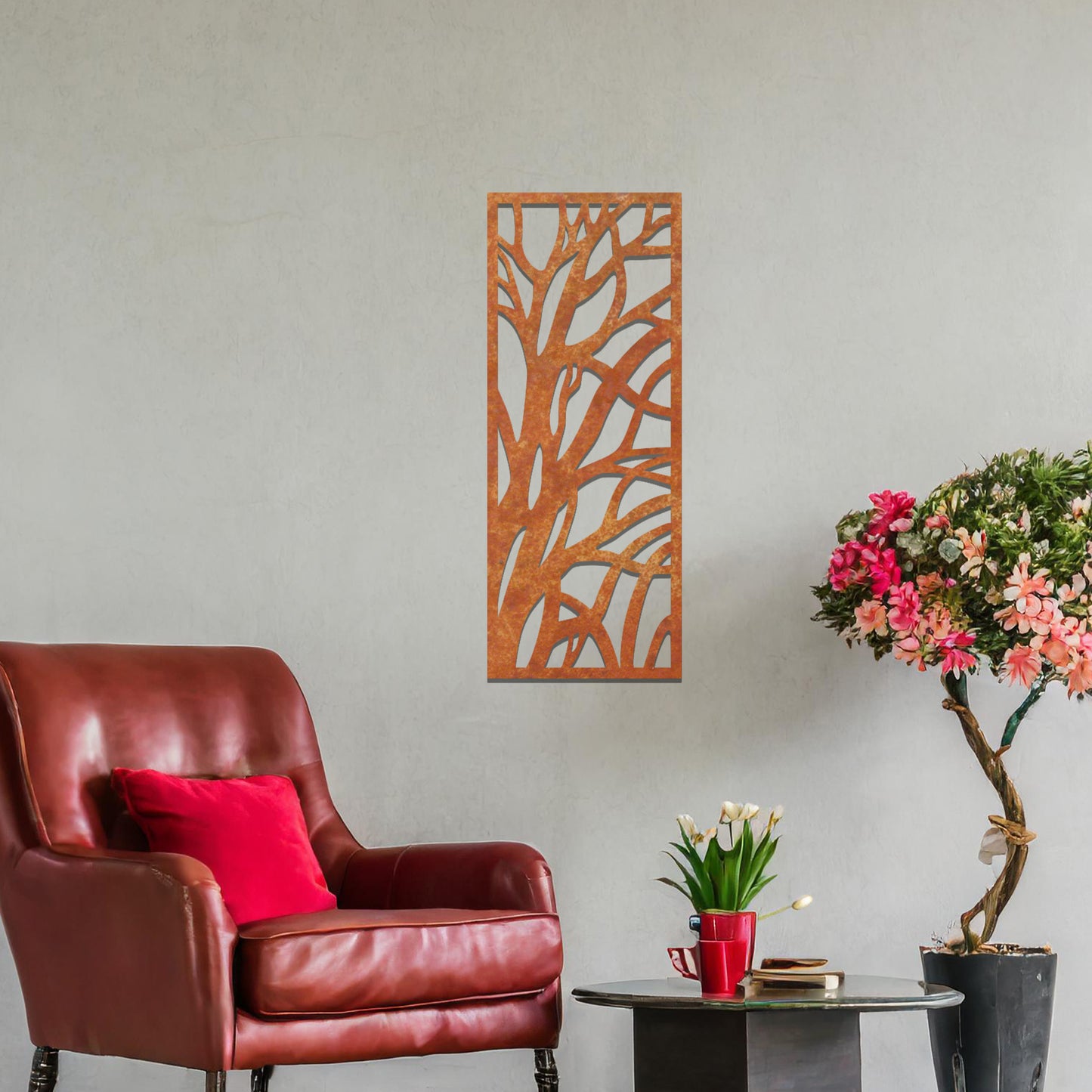 Metal wall art featuring a rectangular design with an abstract tree branch pattern, mounted on a neutral wall within modern room decor. The bold, minimalist craftsmanship adds a touch of natural elegance and contemporary style to the space.