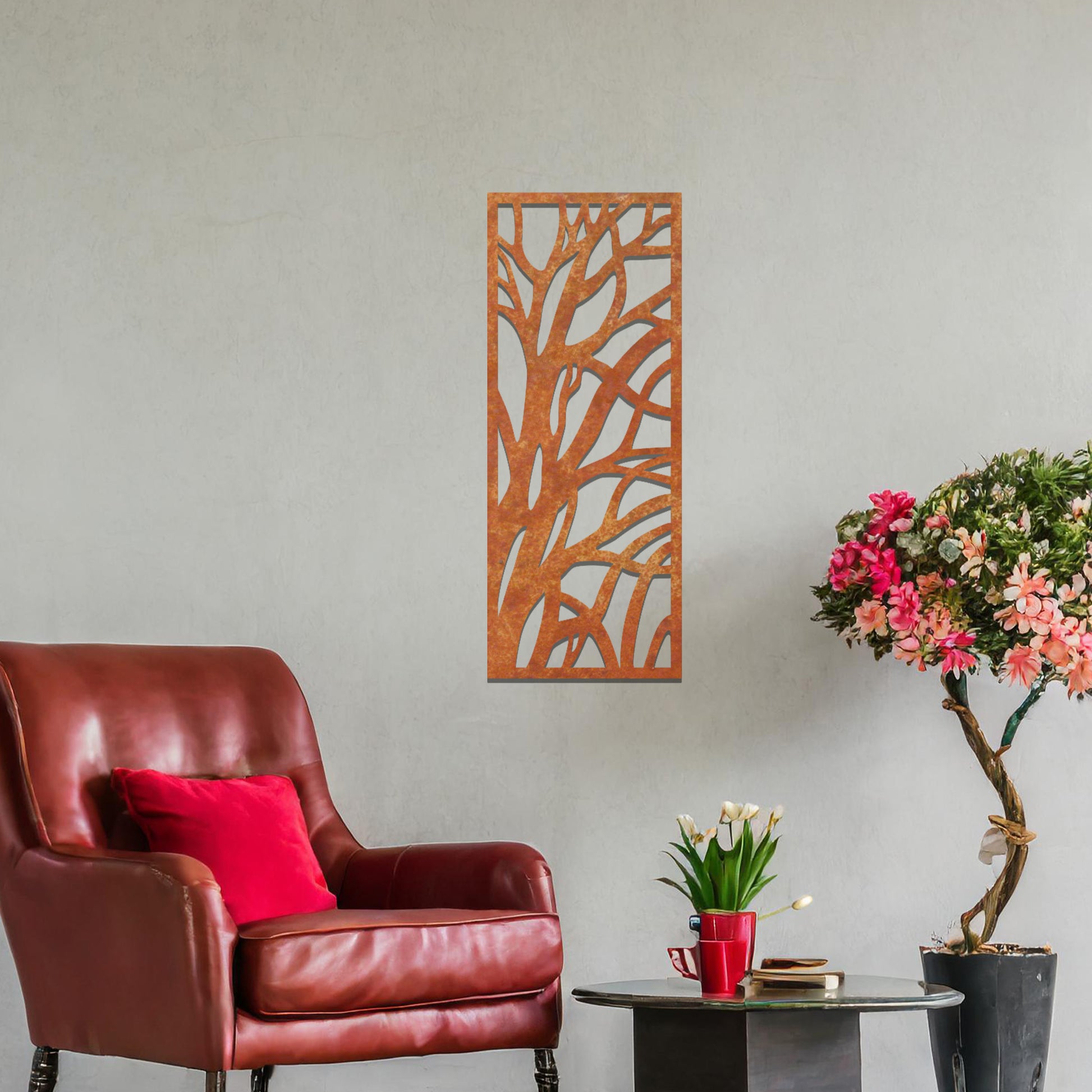 Metal wall art featuring a rectangular design with an abstract tree branch pattern, mounted on a neutral wall within modern room decor. The bold, minimalist craftsmanship adds a touch of natural elegance and contemporary style to the space.