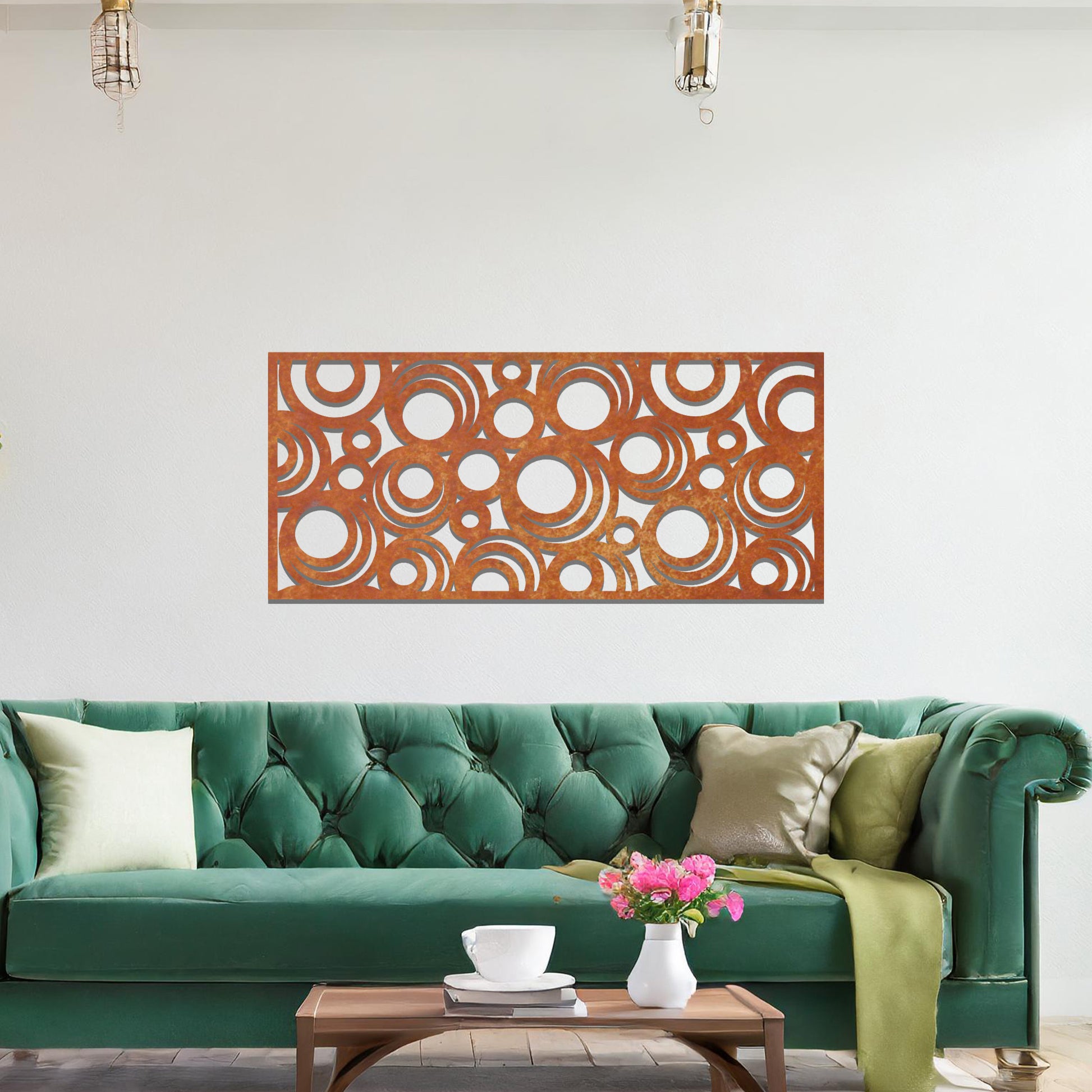 Metal wall art featuring an intricate pattern of overlapping circles in various sizes. The design is set against a neutral wall in a modern living room space, adding a touch of contemporary elegance to the decor.