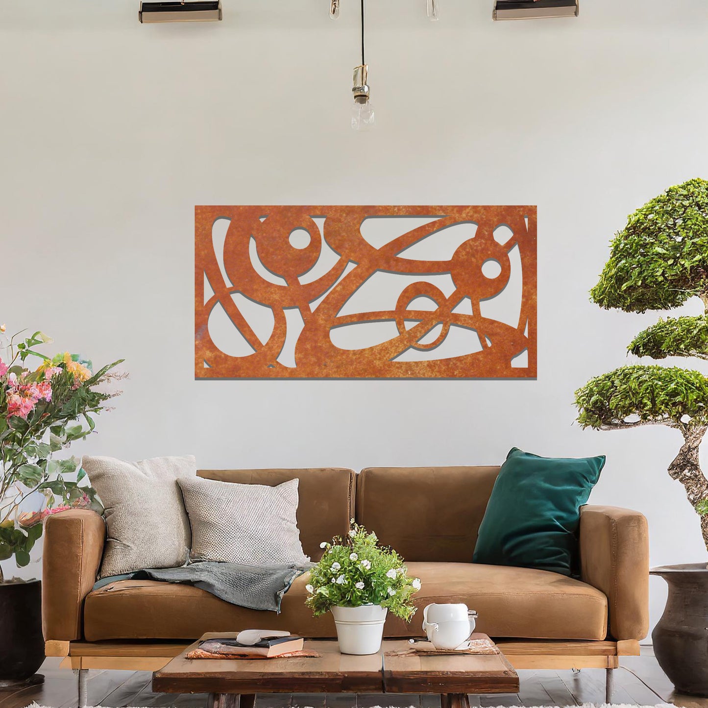 Metal wall art featuring a long, rectangular design with abstract swirling patterns and geometric shapes, mounted on a neutral wall within modern decor. The bold lines and shapes create an eye-catching focal point, adding a touch of artistic flair to the space.
