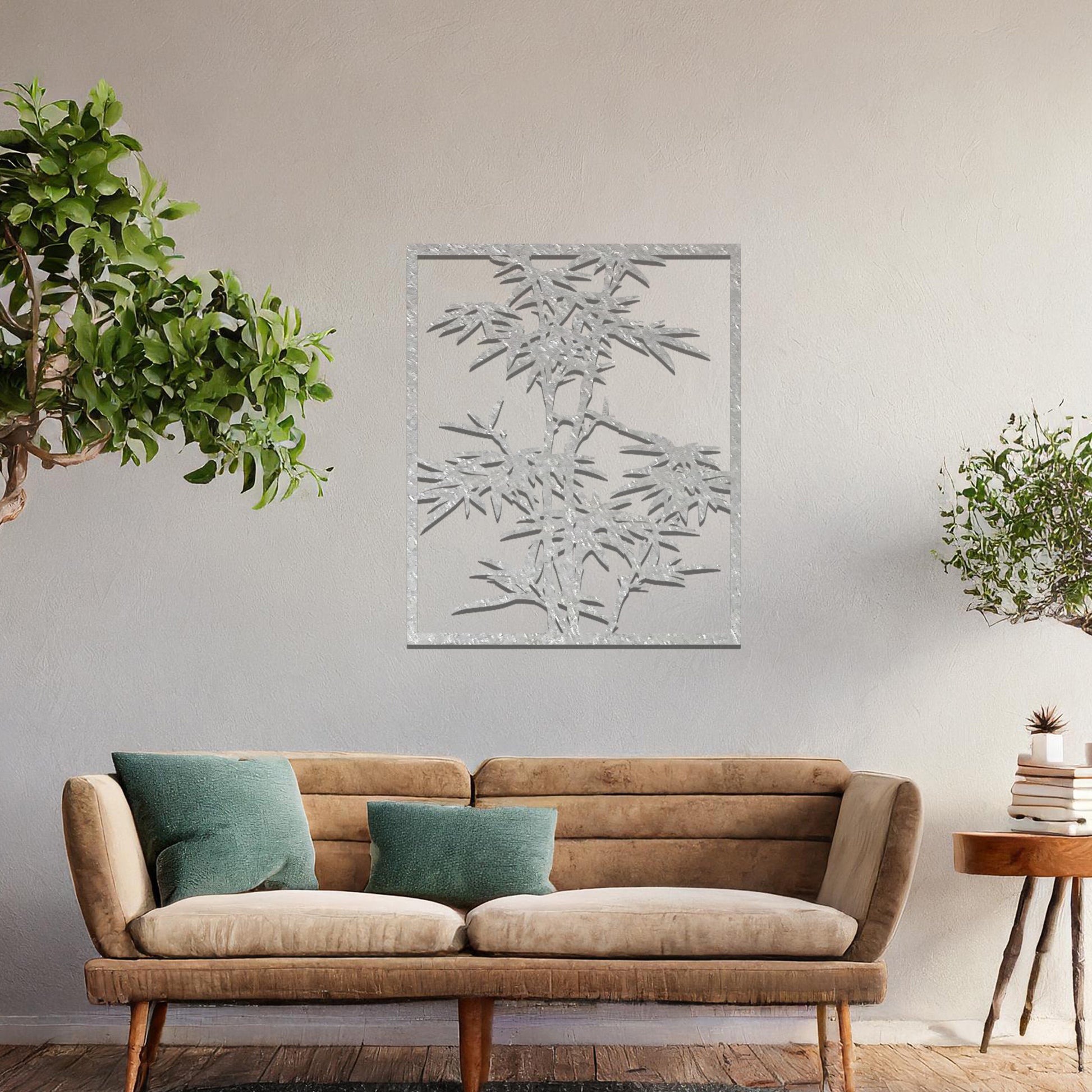 Metal wall art featuring a rectangular design of bamboo stalks with detailed leaves, creating an elegant and nature-inspired accent for the living space.