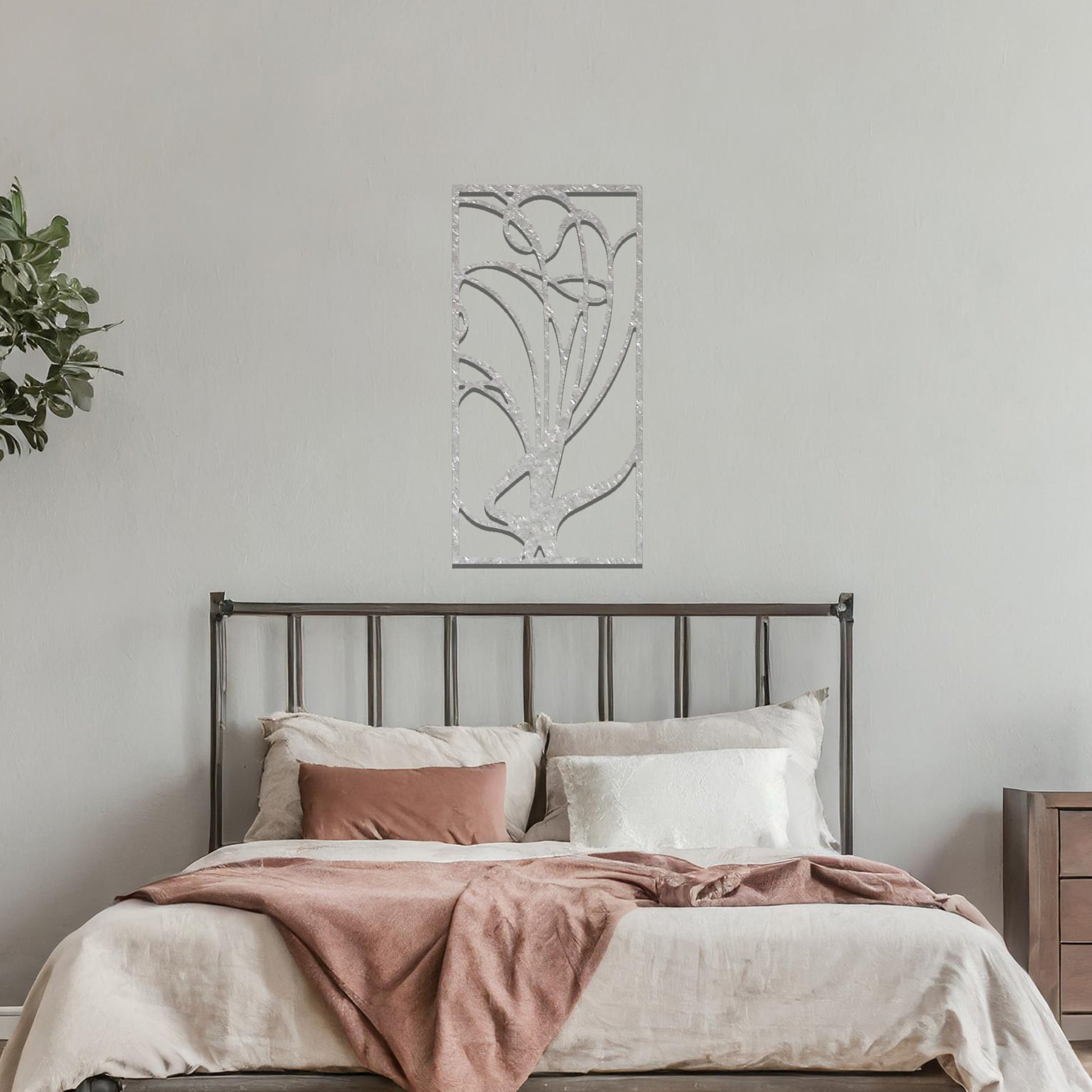 Metal wall art featuring a rectangular abstract design with flowing, interconnected lines, adding a modern and artistic element to the space.