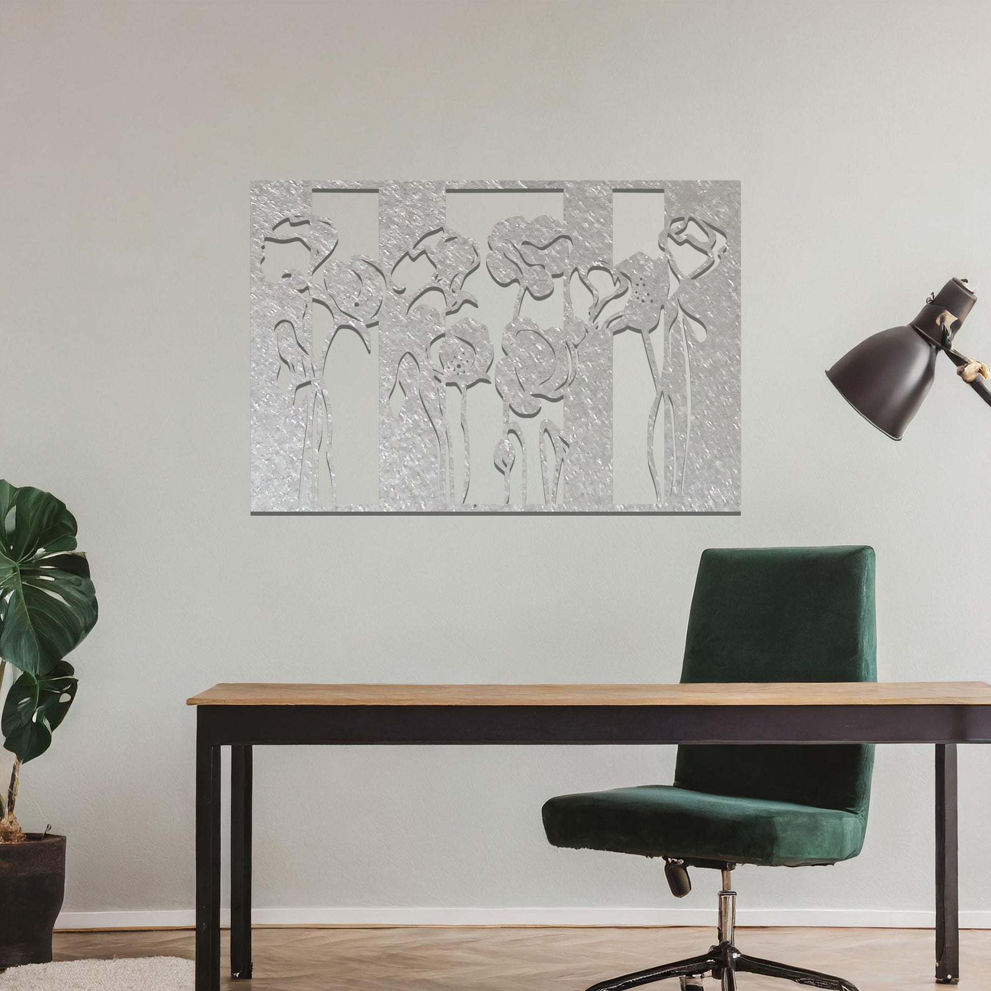 A metal wall art design featuring stylized flowers with long, elegant stems, arranged vertically in a series of three sections. The art is displayed on a neutral wall within a modern room decor, adding a contemporary and artistic touch to the space.