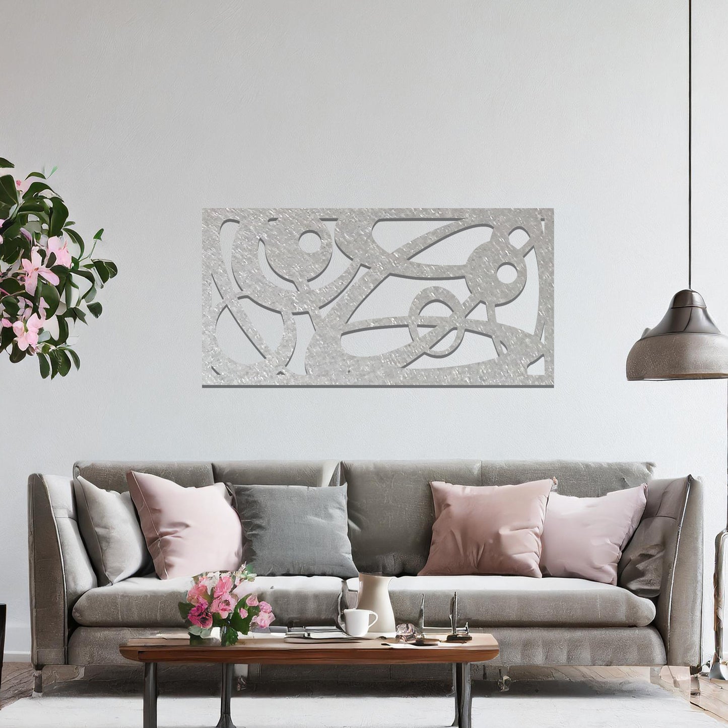 Metal wall art featuring a long, rectangular design with abstract swirling patterns and geometric shapes, mounted on a neutral wall within modern decor. The bold lines and shapes create an eye-catching focal point, adding a touch of artistic flair to the space.