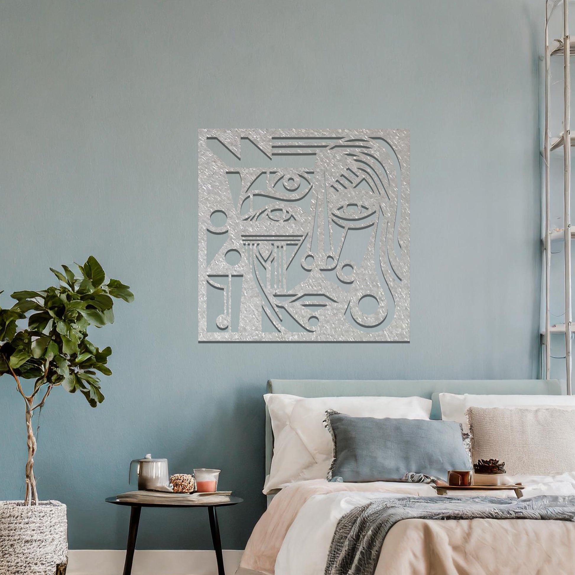 Abstract geometric face design with bold lines, circles, and angles, creating a striking, stylized portrait. The art is displayed on a neutral wall in a modern room setting with minimalistic decor.