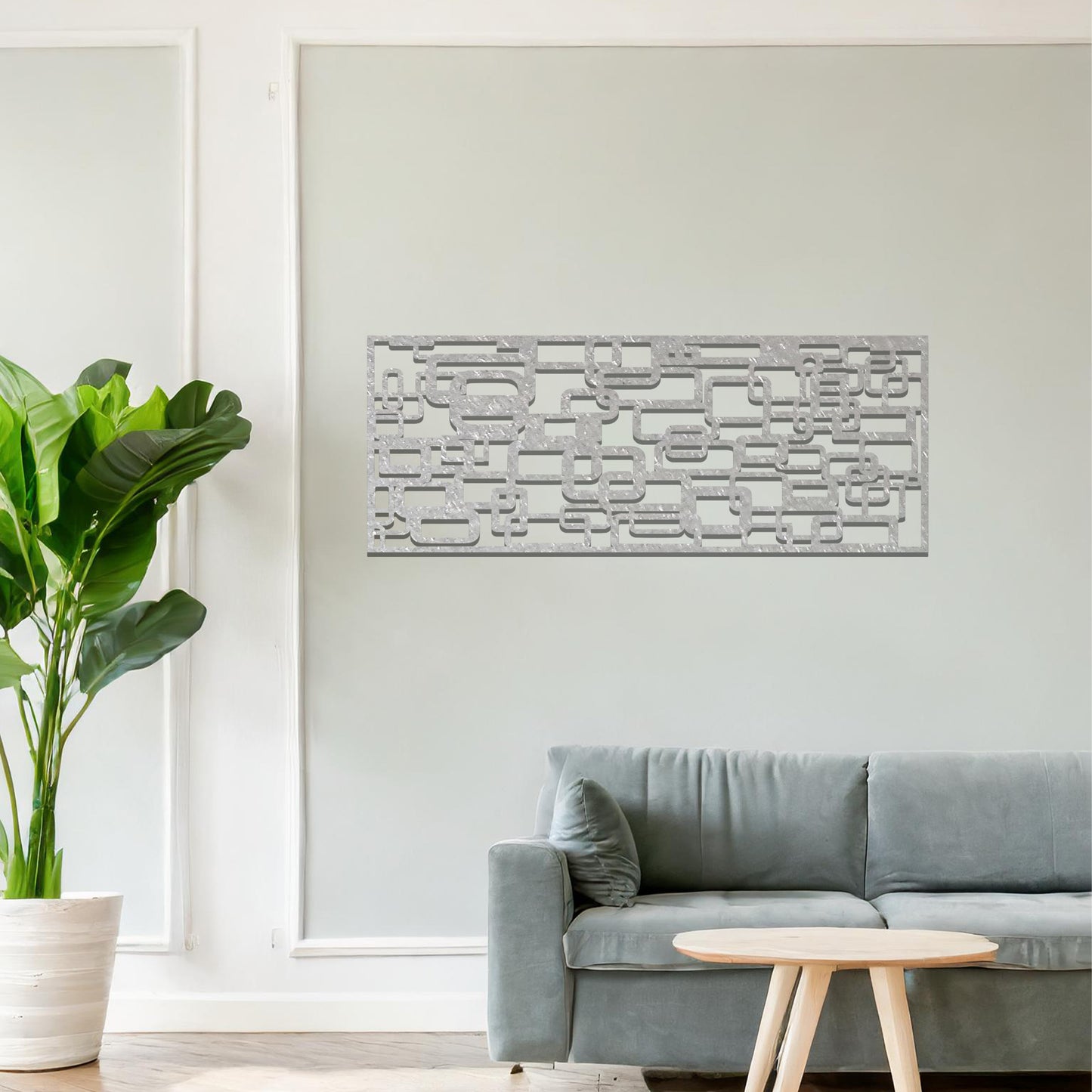Metal wall art featuring an abstract geometric design with overlapping and interlocking rectangular shapes. The artwork is placed on a neutral wall in a modern living room, complementing contemporary decor with its dynamic and stylish form.
