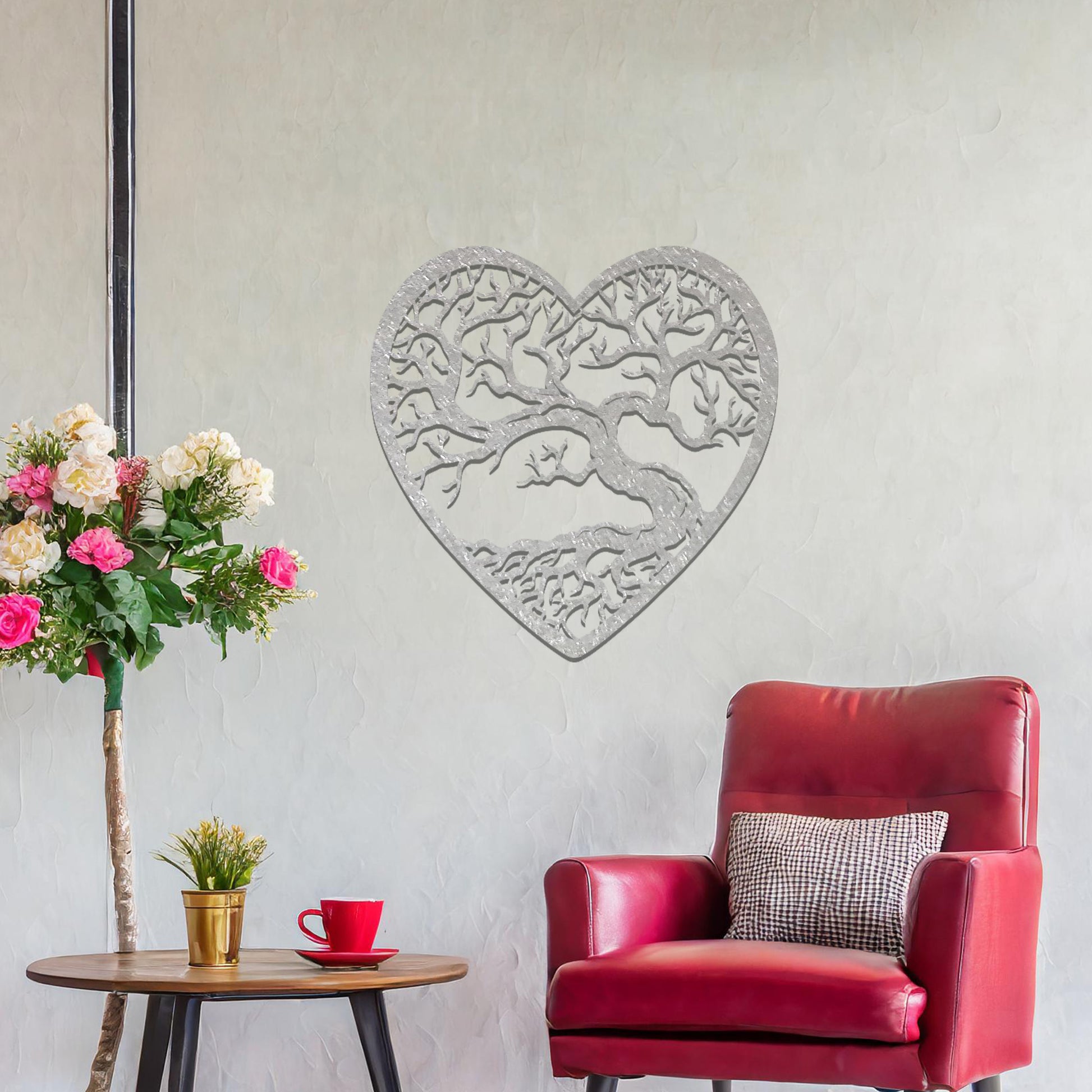Metal wall art featuring a heart-shaped design with a detailed tree and intricate branching pattern, creating a striking and artistic focal point for the room.