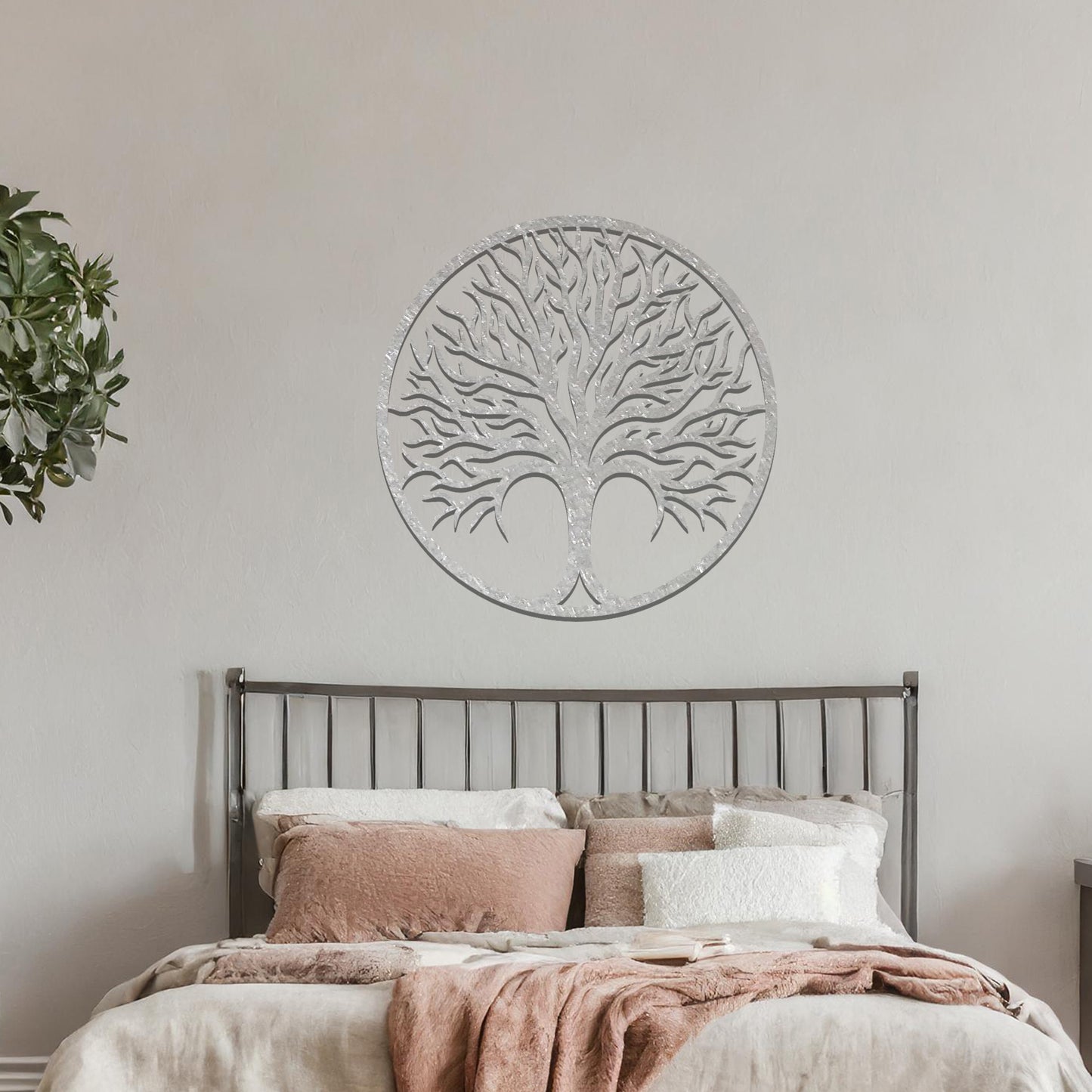 Intricate metal wall art design featuring a tree with a circular frame, highlighting its branching details for a natural and elegant look in modern decor.