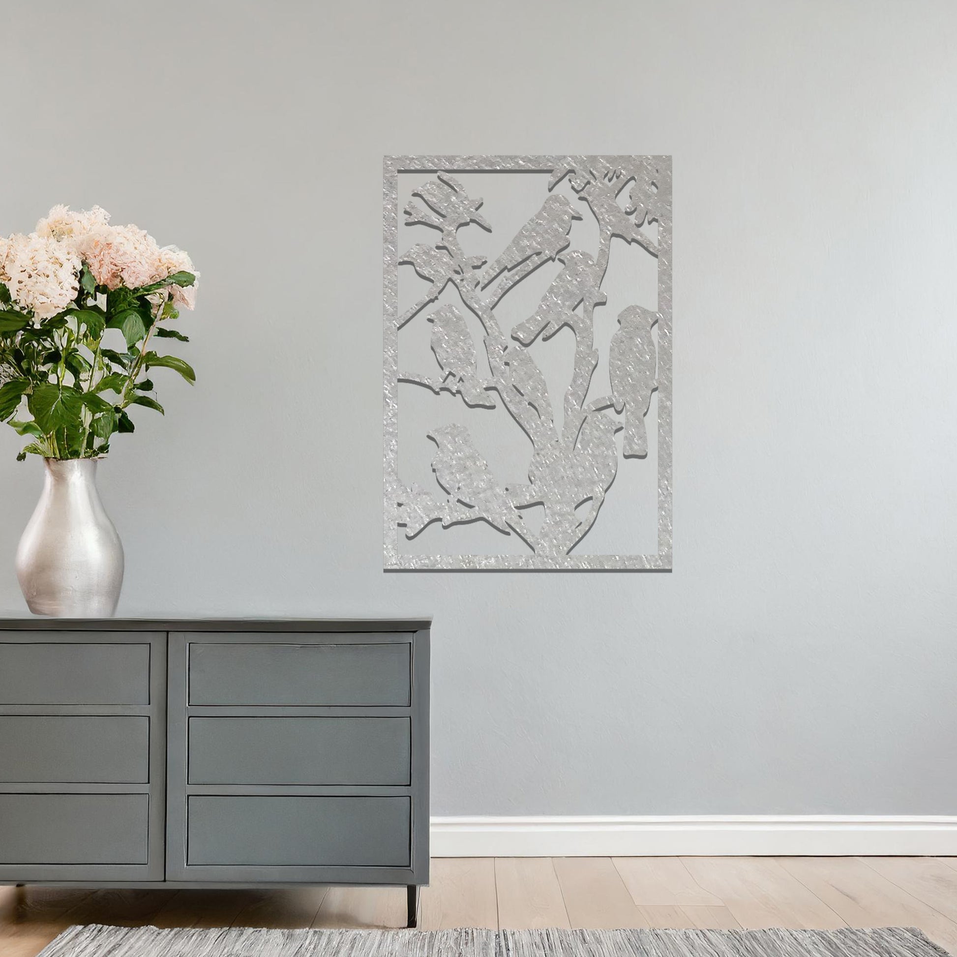 A beautifully crafted wall art featuring a flock of birds perched on branches, showcasing nature's harmony and elegance. A perfect addition to enhance your space with a touch of serenity and charm.