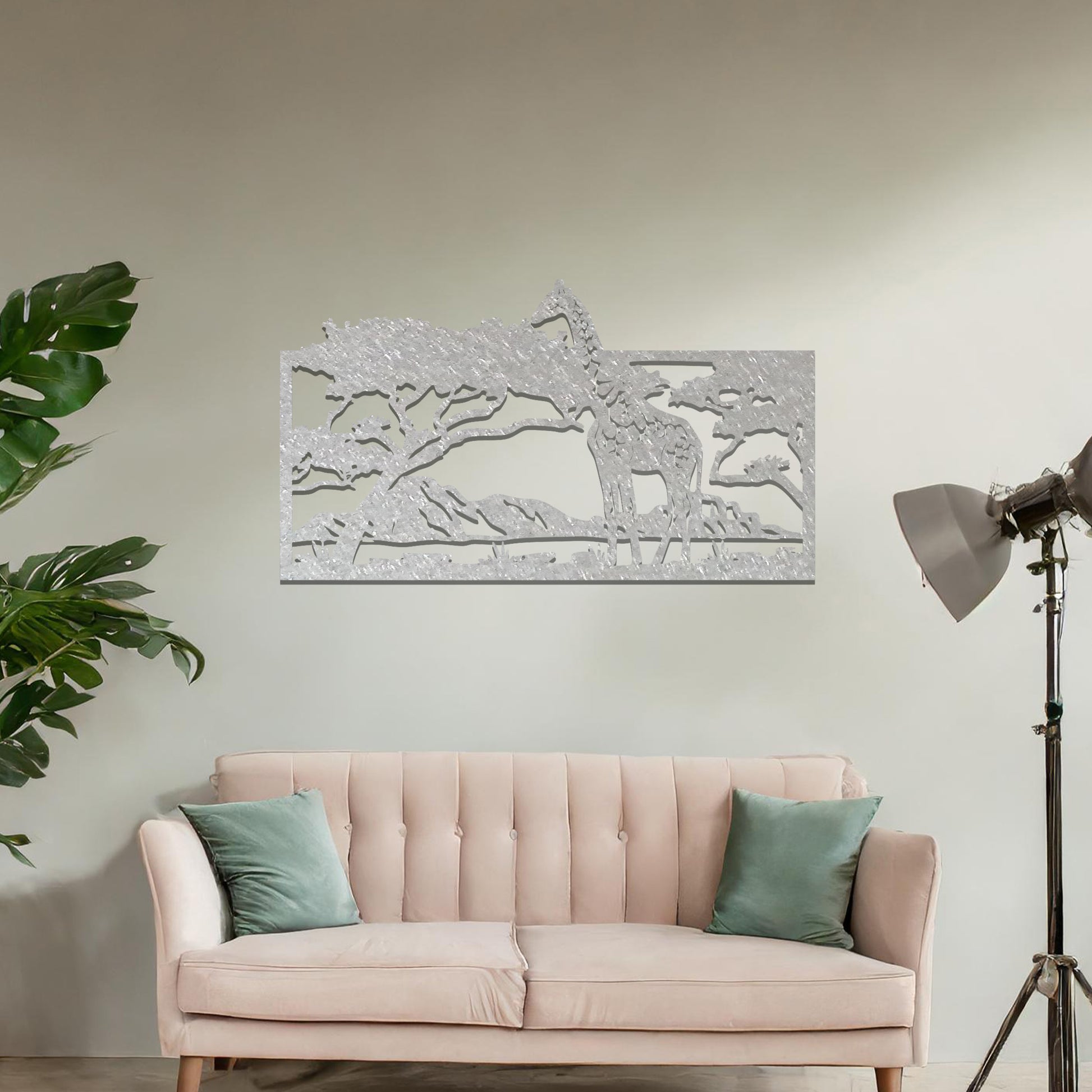 A stunning wall art piece showcasing a giraffe standing gracefully beneath a tree, set against a backdrop of mountains and an expansive savanna landscape. Perfect for bringing an essence of wildlife into your space.