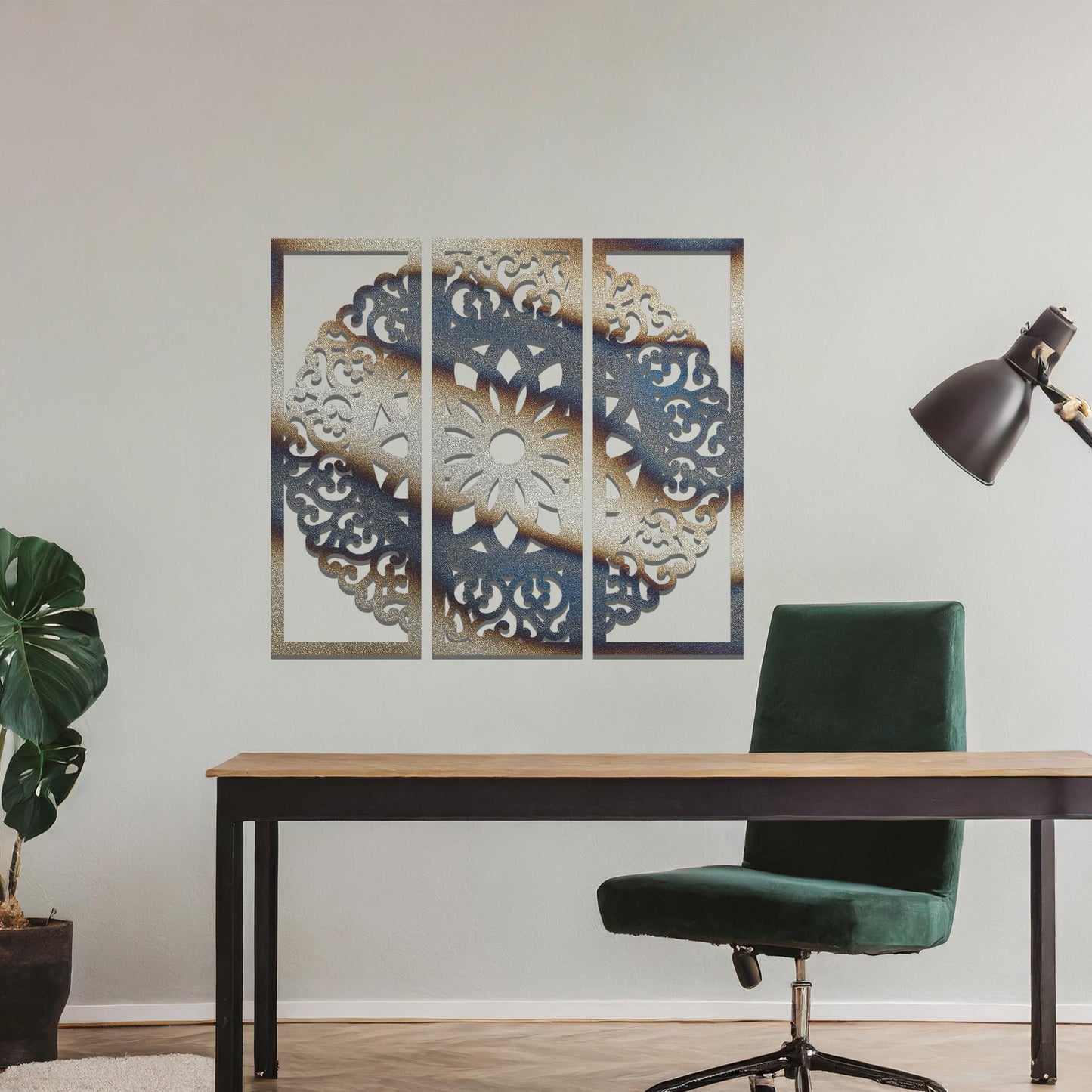 A metal wall art design split into three panels, featuring an intricate floral mandala pattern. The decorative piece is displayed on a neutral wall, adding an elegant, modern touch to the room's decor.