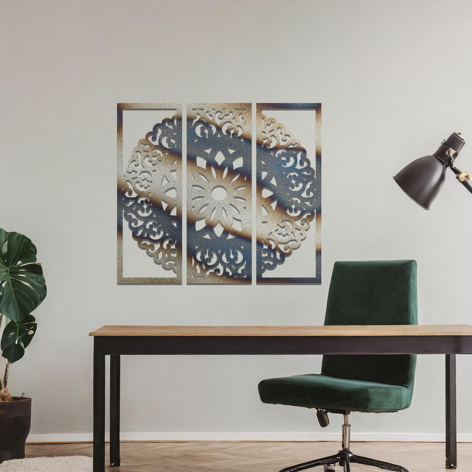 A metal wall art design split into three panels, featuring an intricate floral mandala pattern. The decorative piece is displayed on a neutral wall, adding an elegant, modern touch to the room's decor.