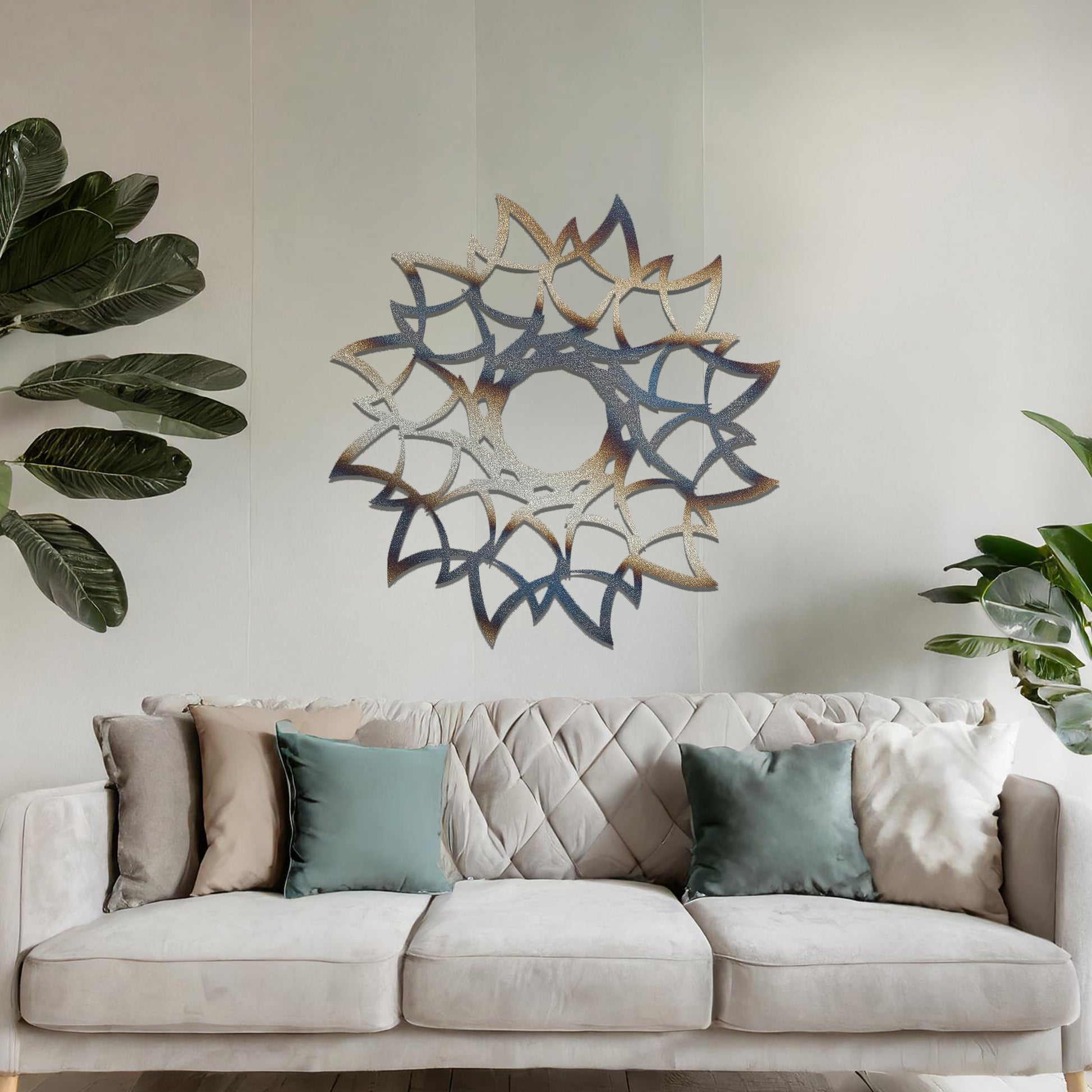 Metal wall art featuring a circular floral-inspired design with layered petal-like patterns, crafted with precise laser-cut detailing, displayed on a neutral wall within modern decor.