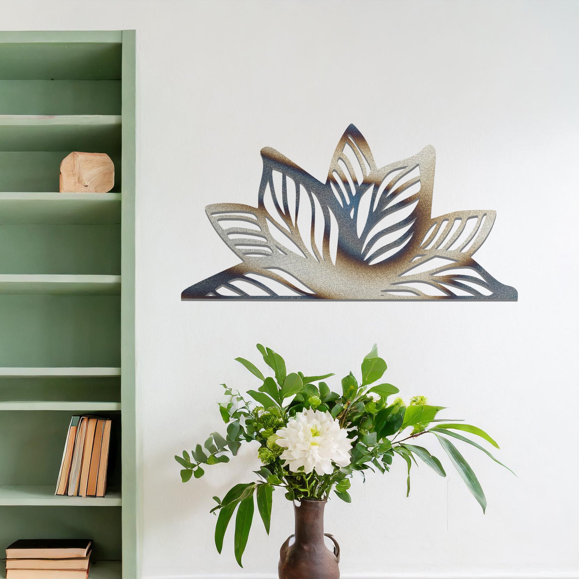 A beautifully intricate metal wall art design featuring a large, stylized lotus flower with detailed, flowing leaves. The art piece is placed on a neutral wall within a modern living room, adding elegance and natural beauty to the space.