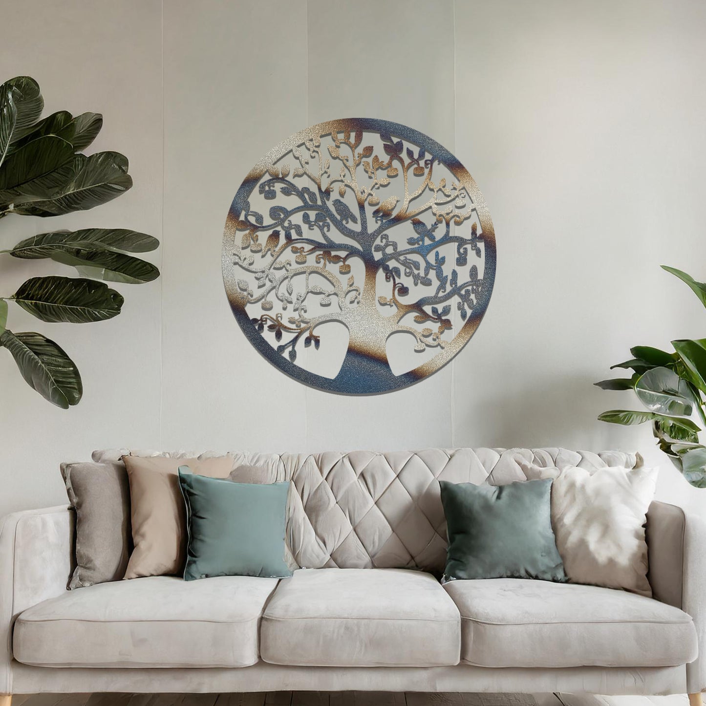 Metal wall art featuring a circular tree design with intricate branches and leaves, showcasing a detailed and balanced composition, displayed on a neutral wall within modern decor.