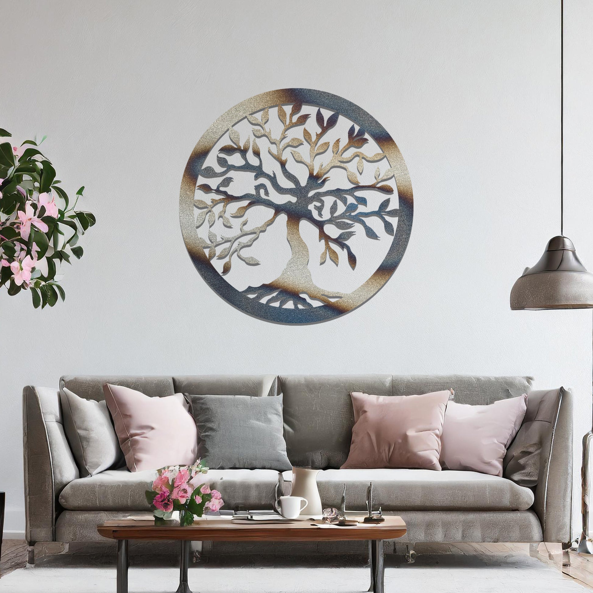 Metal wall art featuring a circular tree of life design with intricate branches and leaves, mounted on a neutral wall within modern bedroom decor. The detailed craftsmanship and symbolic motif create a calming and elegant focal point in the room.
