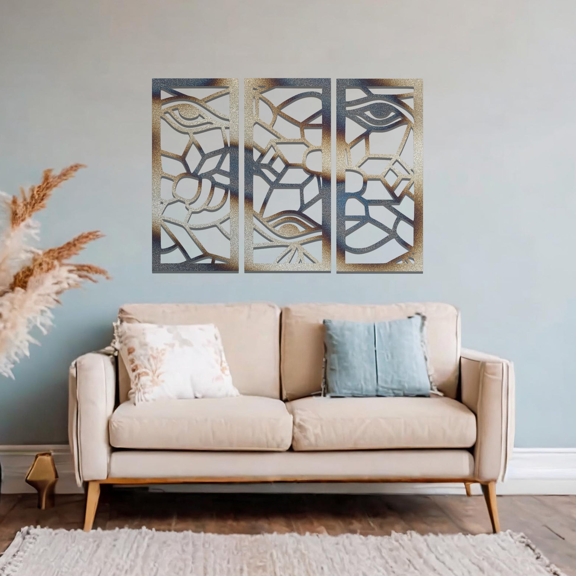 Decorative metal wall art featuring a set of three geometric panels with intricate abstract designs, mounted on a neutral wall within modern room decor. The focus is on the unique craftsmanship and harmonious composition of the wall art, enhancing the contemporary aesthetic of the space.