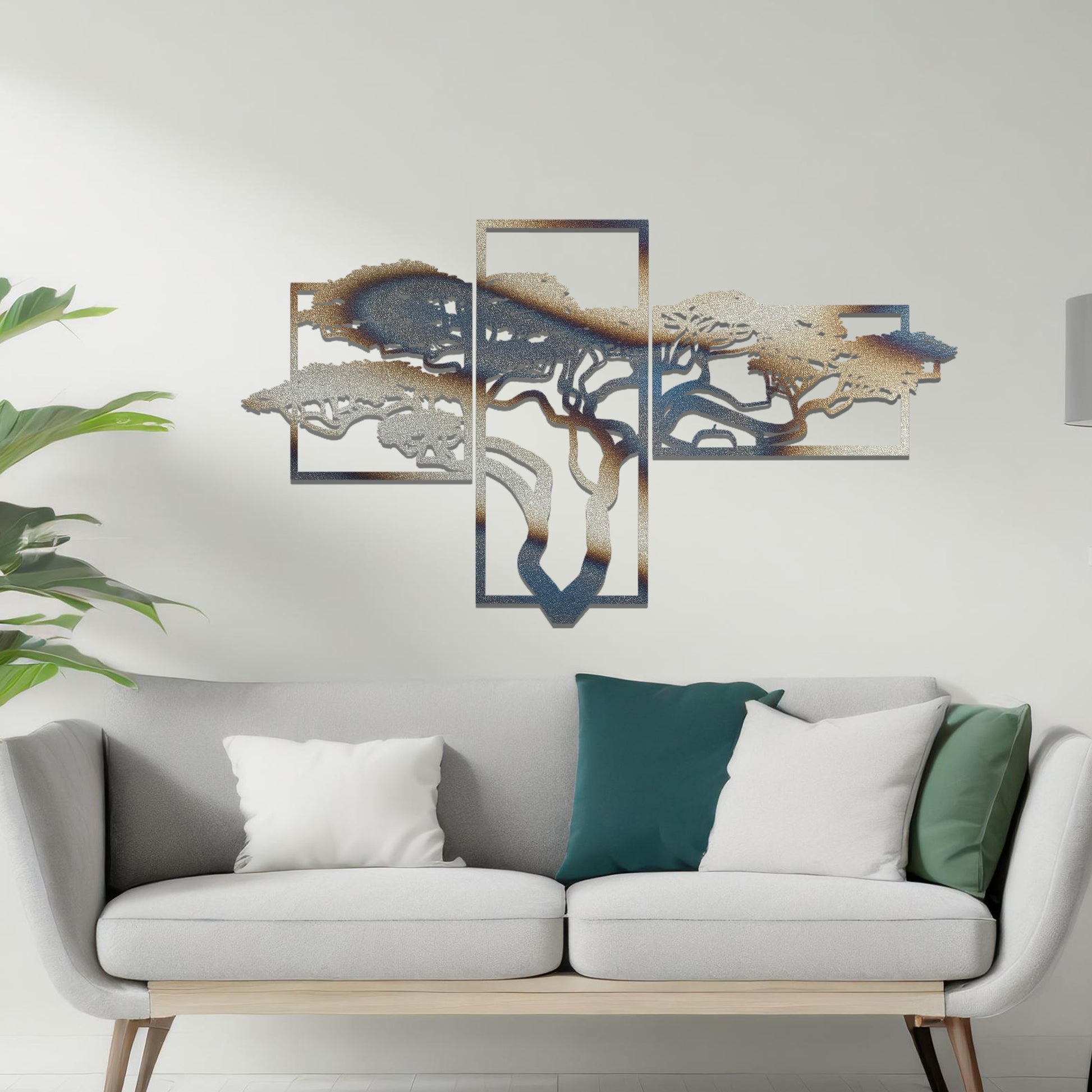 Metal wall art featuring a multi-panel tree design with a detailed branching structure, crafted with precise laser-cut techniques, displayed on a neutral wall within modern decor.