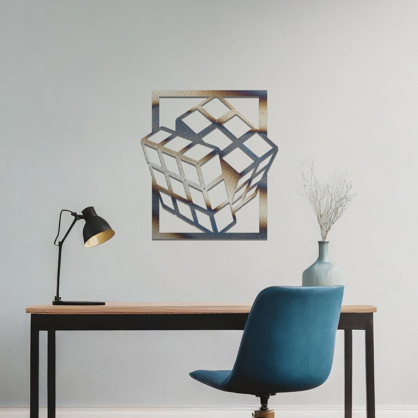 Metal wall art featuring a rectangular design of a three-dimensional cube, showcasing bold geometric shapes and a modern aesthetic as a statement piece.