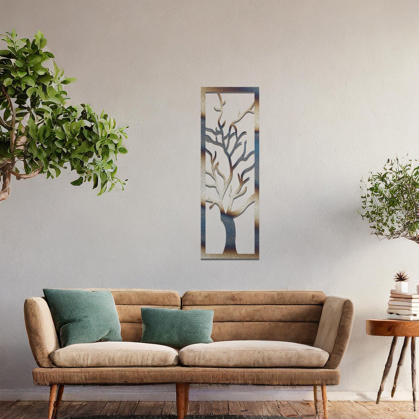 Metal wall art featuring a vertical design of a bare tree with intricate branches, mounted on a neutral wall within elegant room decor. The minimalist silhouette of the tree adds a sophisticated, natural focal point to the space.