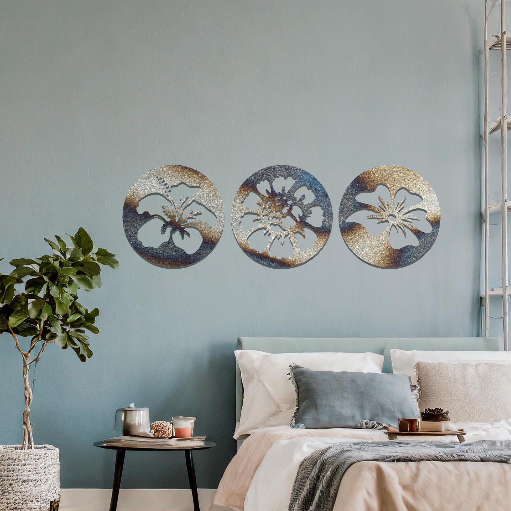 A set of three circular metal panels featuring floral designs, each panel showcasing a different flower in intricate detail. The artwork is displayed on a neutral wall, enhancing the serene and natural ambiance of the bedroom.