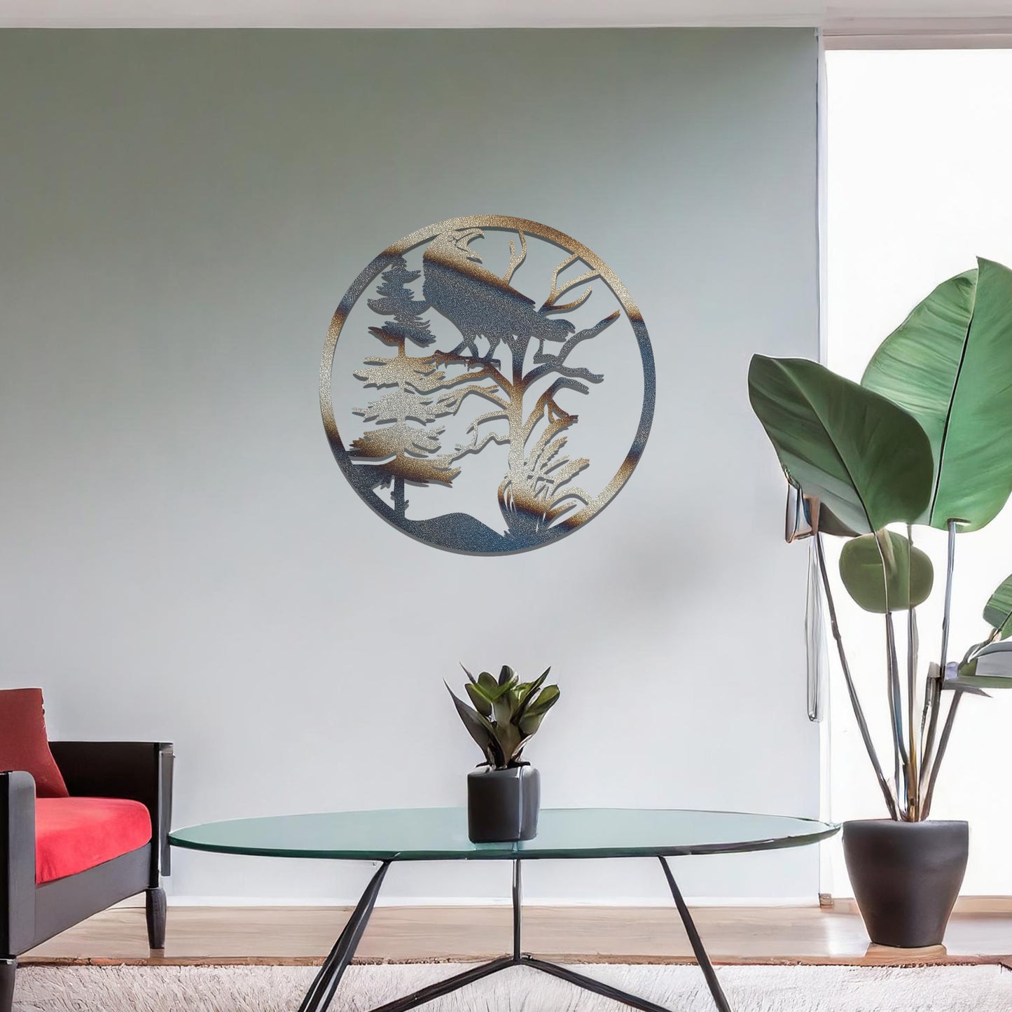 Metal wall art featuring a circular design with a silhouette of a raven perched on a tree branch, surrounded by trees and foliage, mounted on a neutral wall within modern room decor. The intricate detailing and natural motif create a bold and artistic focal point in the space.