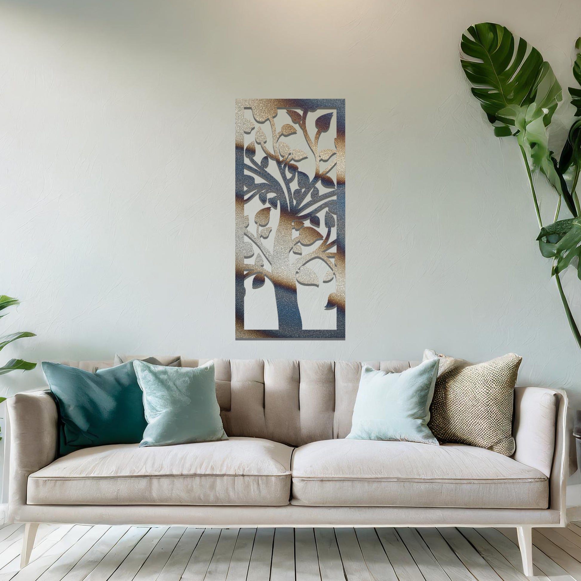 Metal wall art featuring a rectangular design with a stylised tree motif, showcasing flowing branches and leaves, mounted on a neutral wall within modern room decor. The minimalist craftsmanship adds a sleek and natural aesthetic, enhancing the contemporary elegance of the space.