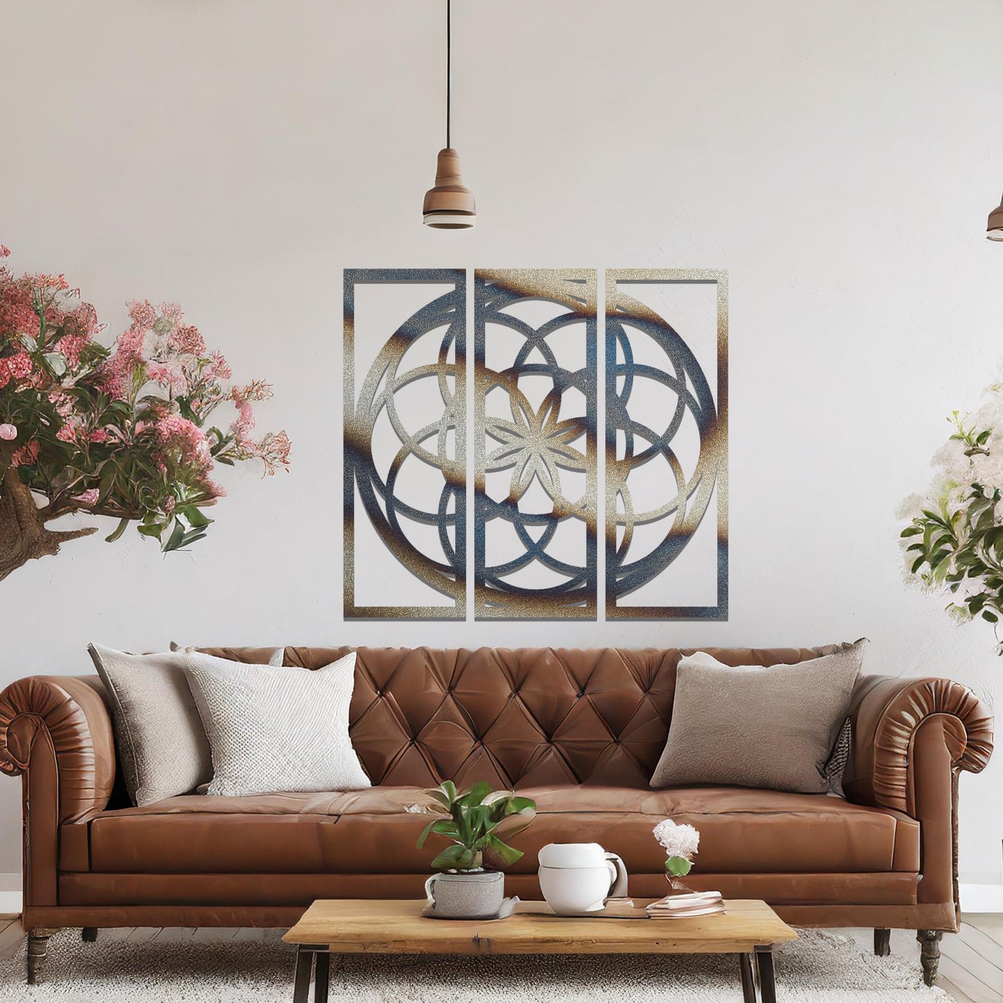 A three-panel metal wall art featuring a geometric floral pattern with interlocking circles and a star-shaped center. The design is displayed on a neutral wall, enhancing the room's modern aesthetic with its elegant symmetry.