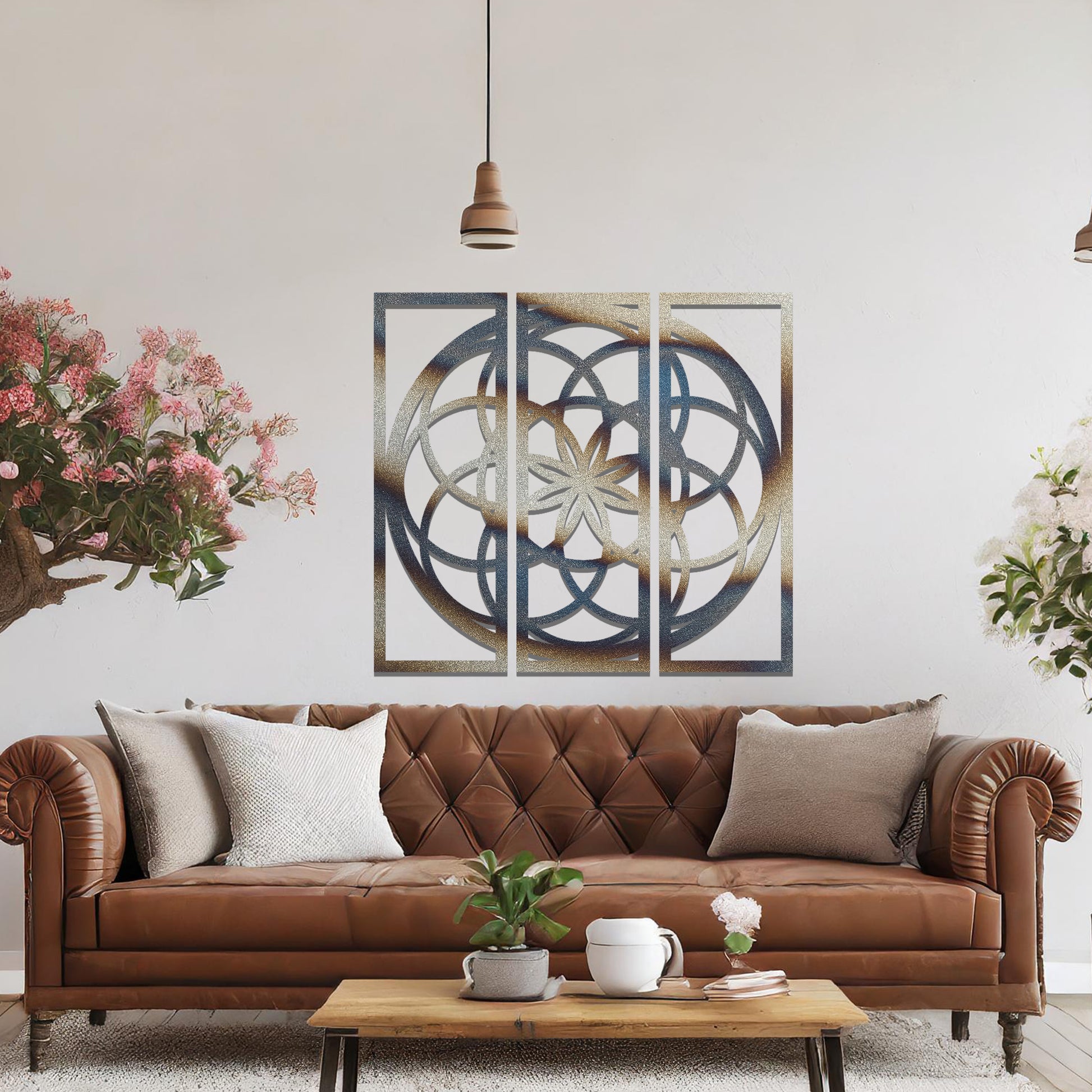 A three-panel metal wall art featuring a geometric floral pattern with interlocking circles and a star-shaped center. The design is displayed on a neutral wall, enhancing the room's modern aesthetic with its elegant symmetry.
