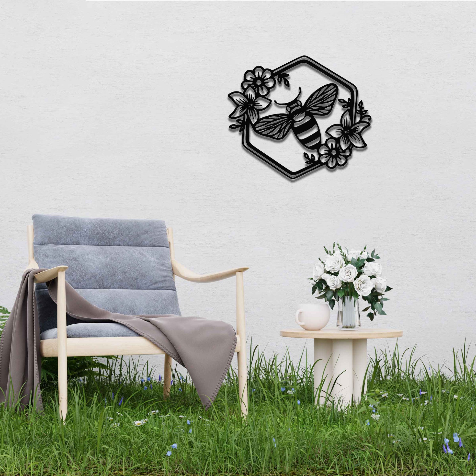 Metal garden decoration showcasing a bee design within a hexagonal frame, adorned with floral details, combining nature-inspired artistry and durability to enhance outdoor spaces with elegance and charm.