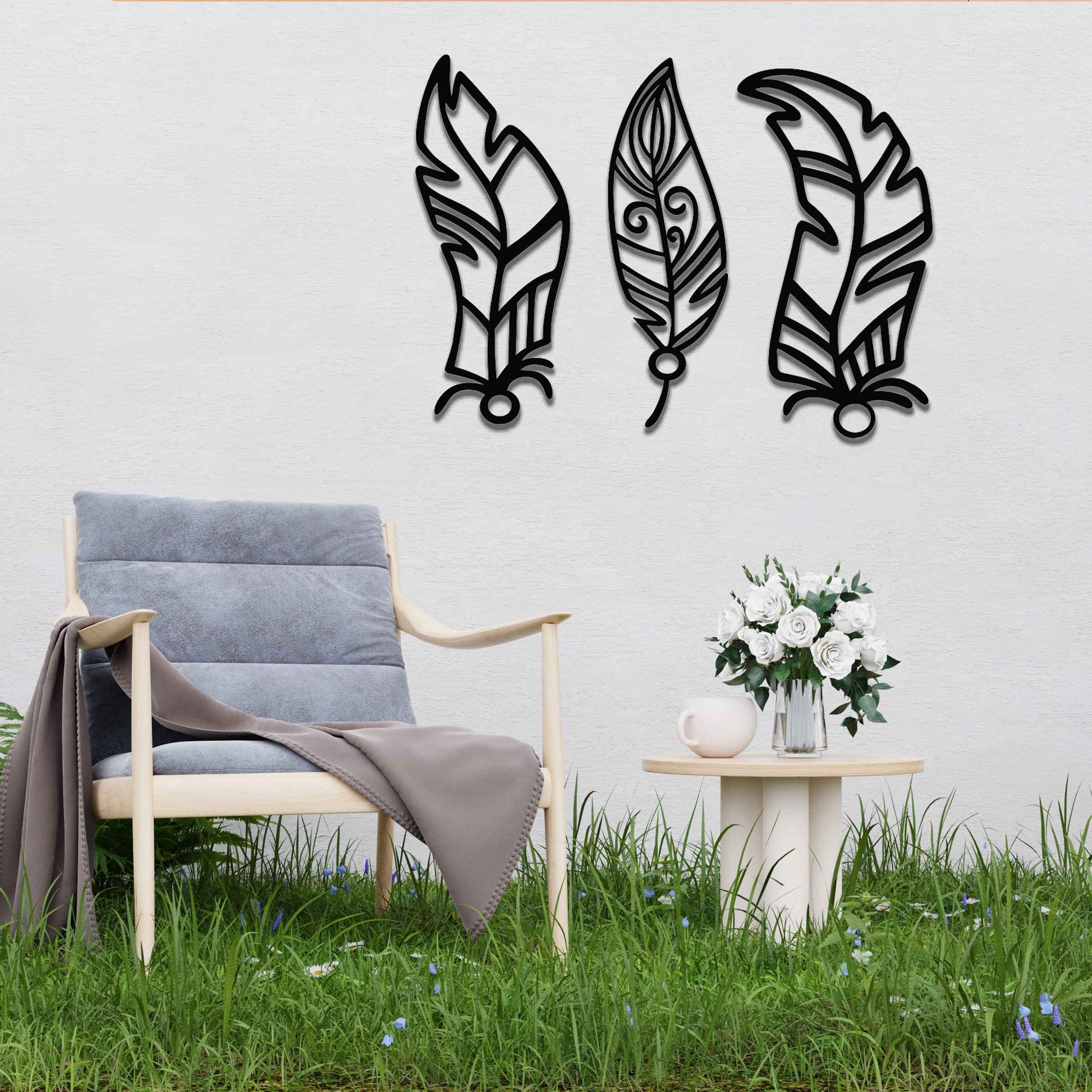 This design features three elegantly styled feathers, each with intricate patterns. The flowing lines and curved shapes give a sense of movement, making the artwork a beautiful representation of nature's delicate beauty.