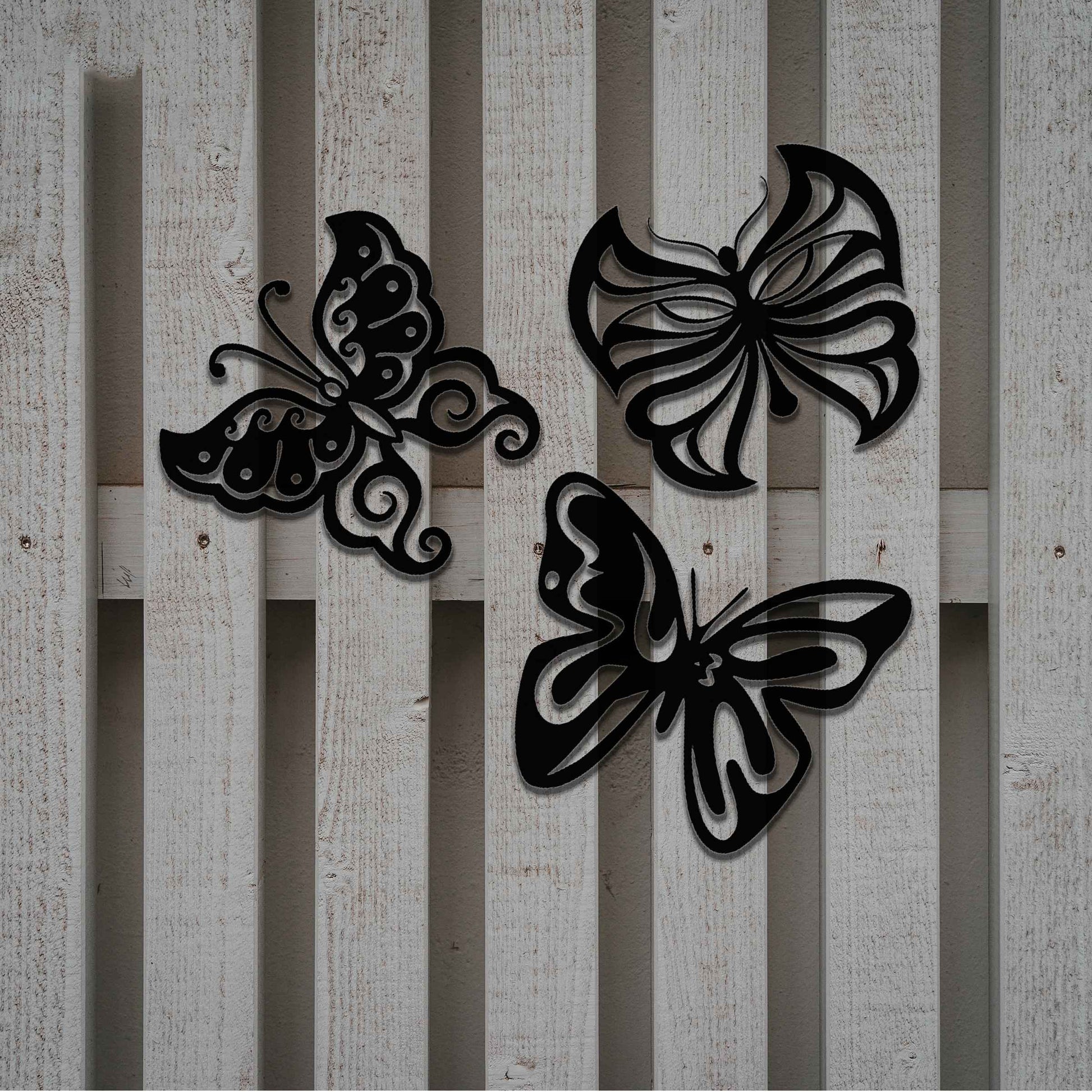 Set of metal garden decorations featuring three distinct butterfly designs with intricate patterns, adding a playful and nature-inspired charm to outdoor walls, fences, or garden spaces