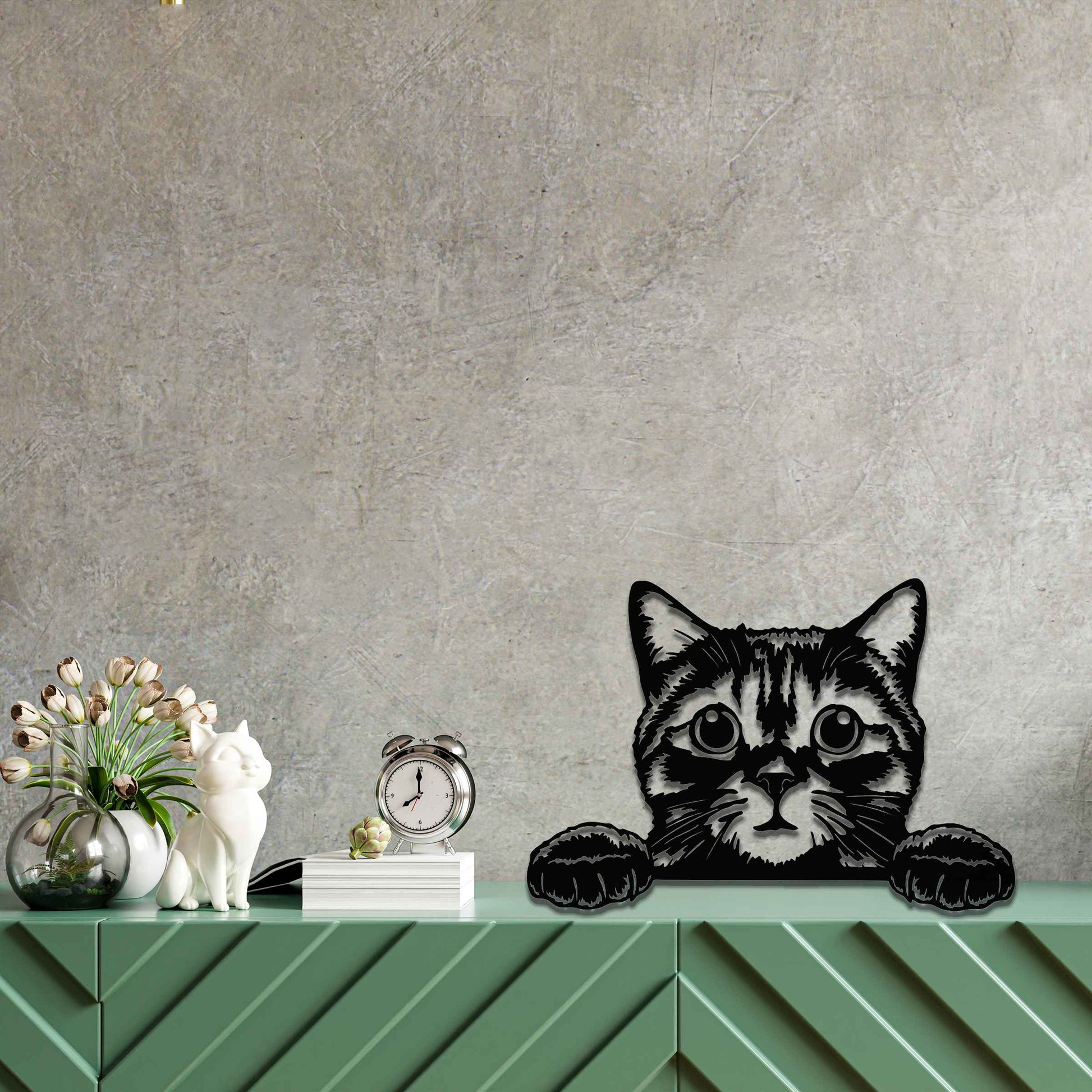 A charming metal wall art piece featuring an adorable cat peeking over a surface, its wide eyes and paws reaching out, adding a playful and endearing touch to modern home decor.