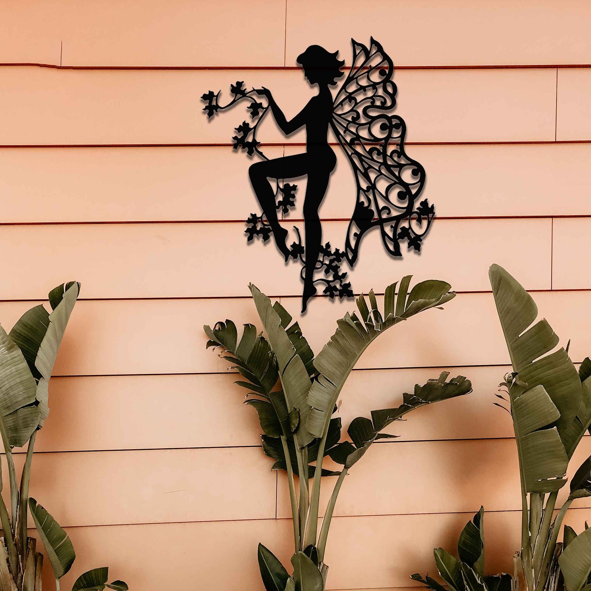 This design features a graceful fairy holding a delicate flower vine, with her wings artfully adorned in intricate patterns. The elegant pose and detailed flow of flowers evoke a sense of lightness and enchantment.