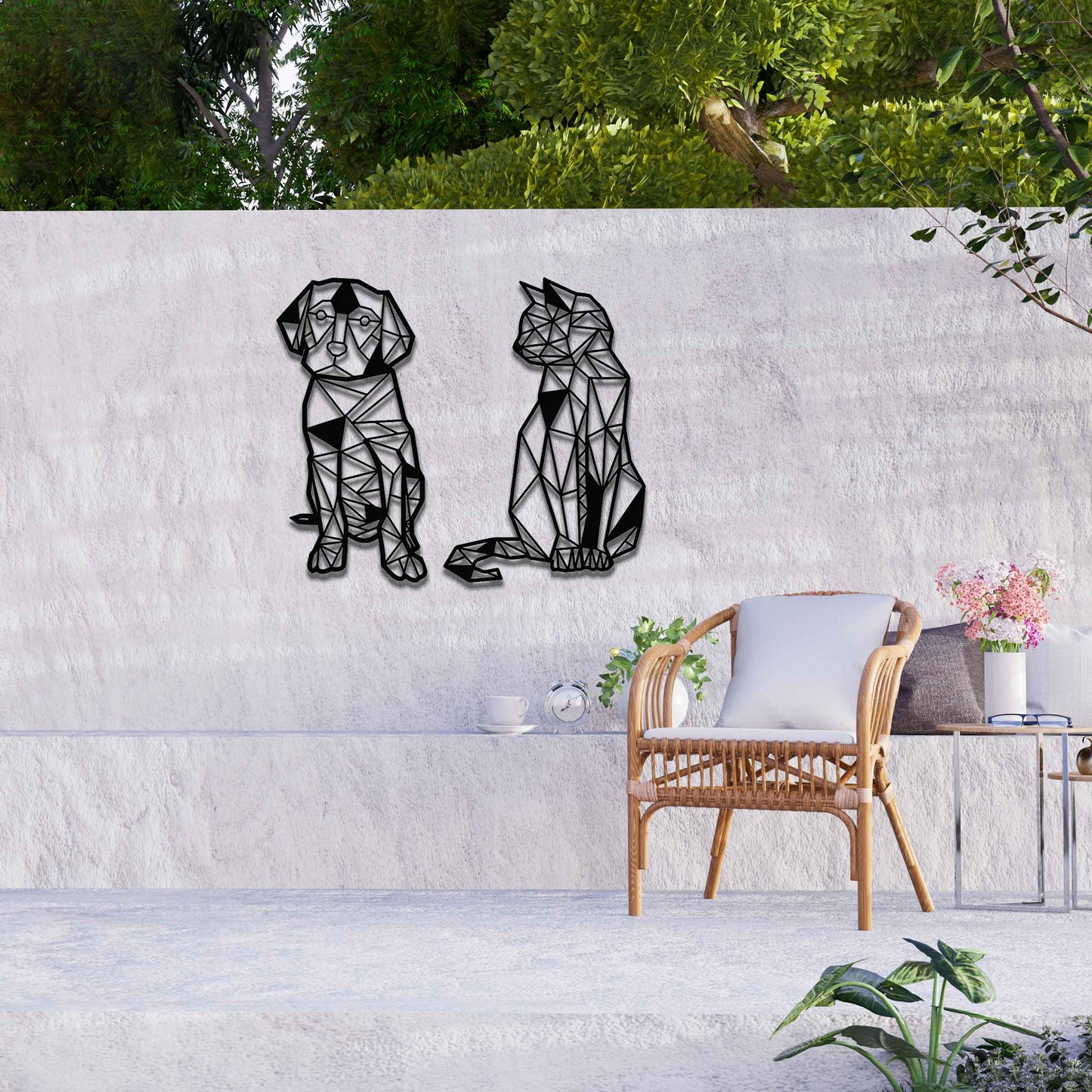 This image displays geometric-style black metal art featuring a dog and a cat, placed side by side. The angular, modern design of the animals contrasts beautifully with the natural greenery around, offering a stylish touch to the surrounding space.