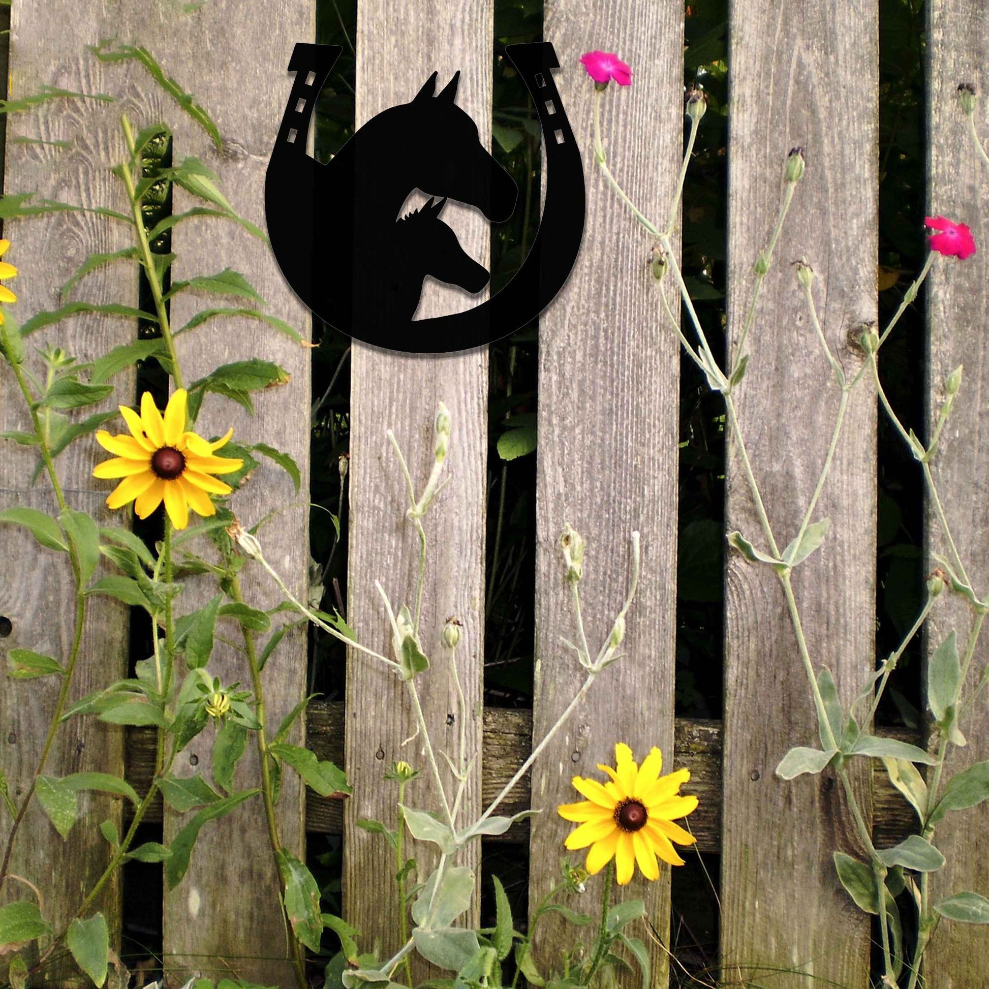 Metal garden decoration featuring a horse silhouette enclosed within a horseshoe design, crafted with a rustic finish, adding a touch of equestrian charm and character to outdoor walls or garden spaces