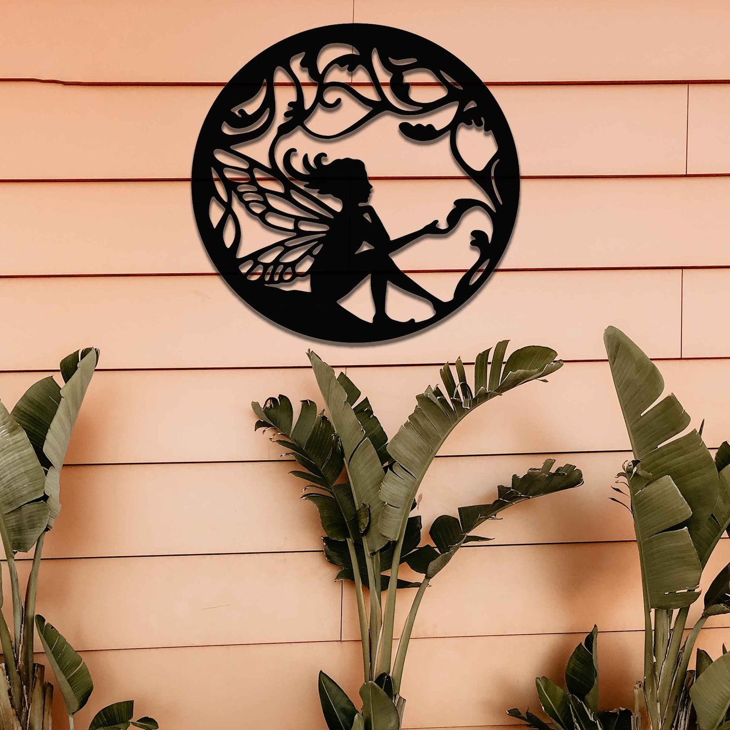 This design depicts a whimsical fairy seated amidst delicate flowing vines, her wings beautifully outlined. The intricate pattern creates an enchanting atmosphere, capturing the essence of nature's magic and wonder.