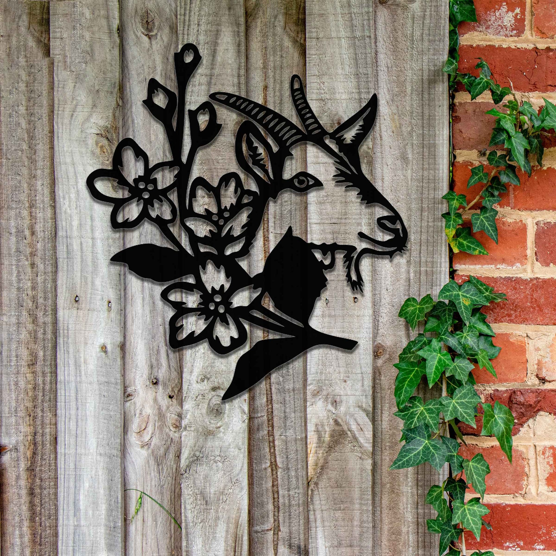 Goat head silhouette with delicate floral details integrated into the design. The artwork captures the goat’s profile surrounded by blooming flowers, creating a rustic, natural aesthetic for modern wall decor.