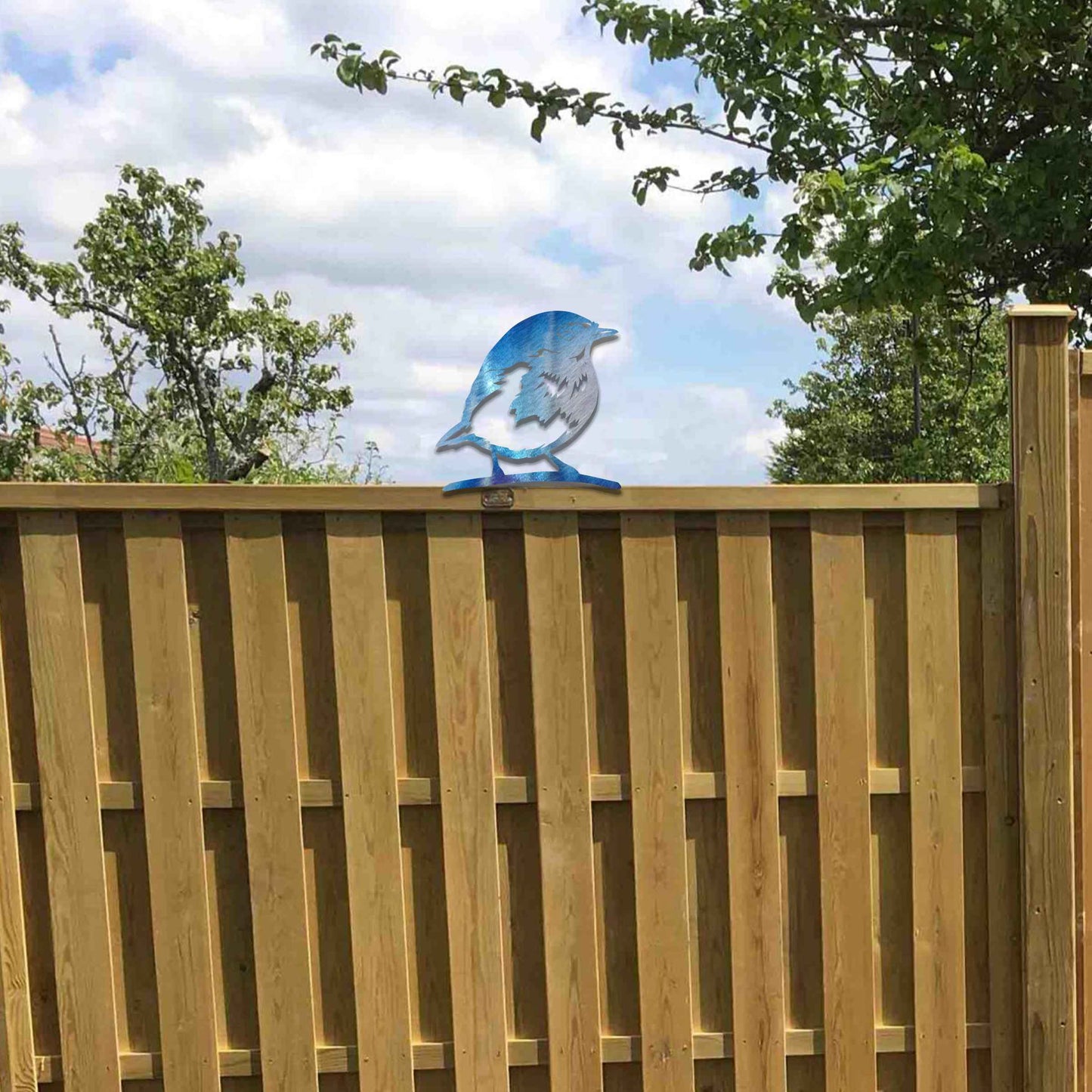 Metal garden decoration featuring a robin silhouette with a rustic finish, designed to sit atop fences or posts, adding a charming and natural touch to outdoor garden spaces.