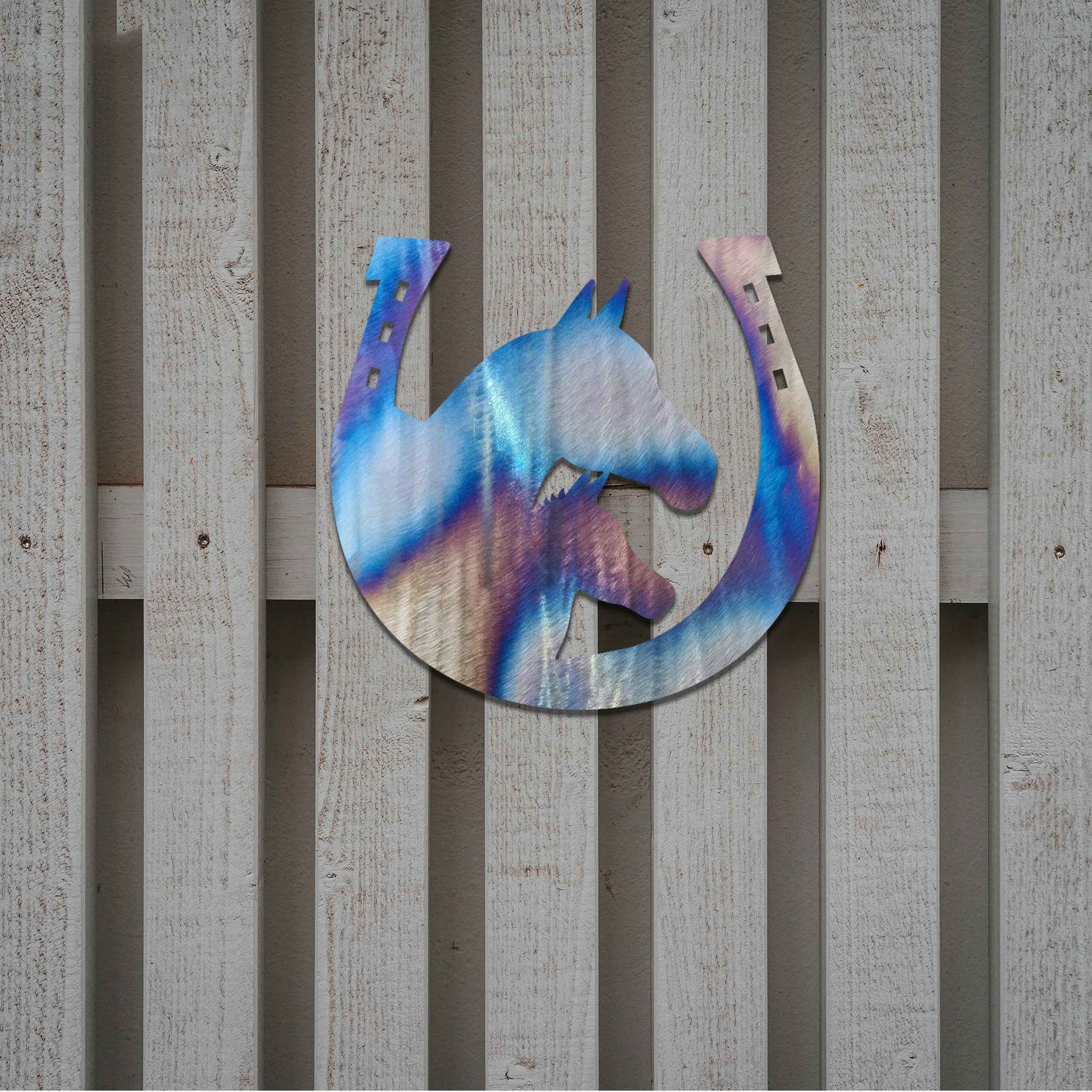 Metal garden decoration featuring a horse silhouette enclosed within a horseshoe design, crafted with a rustic finish, adding a touch of equestrian charm and character to outdoor walls or garden spaces