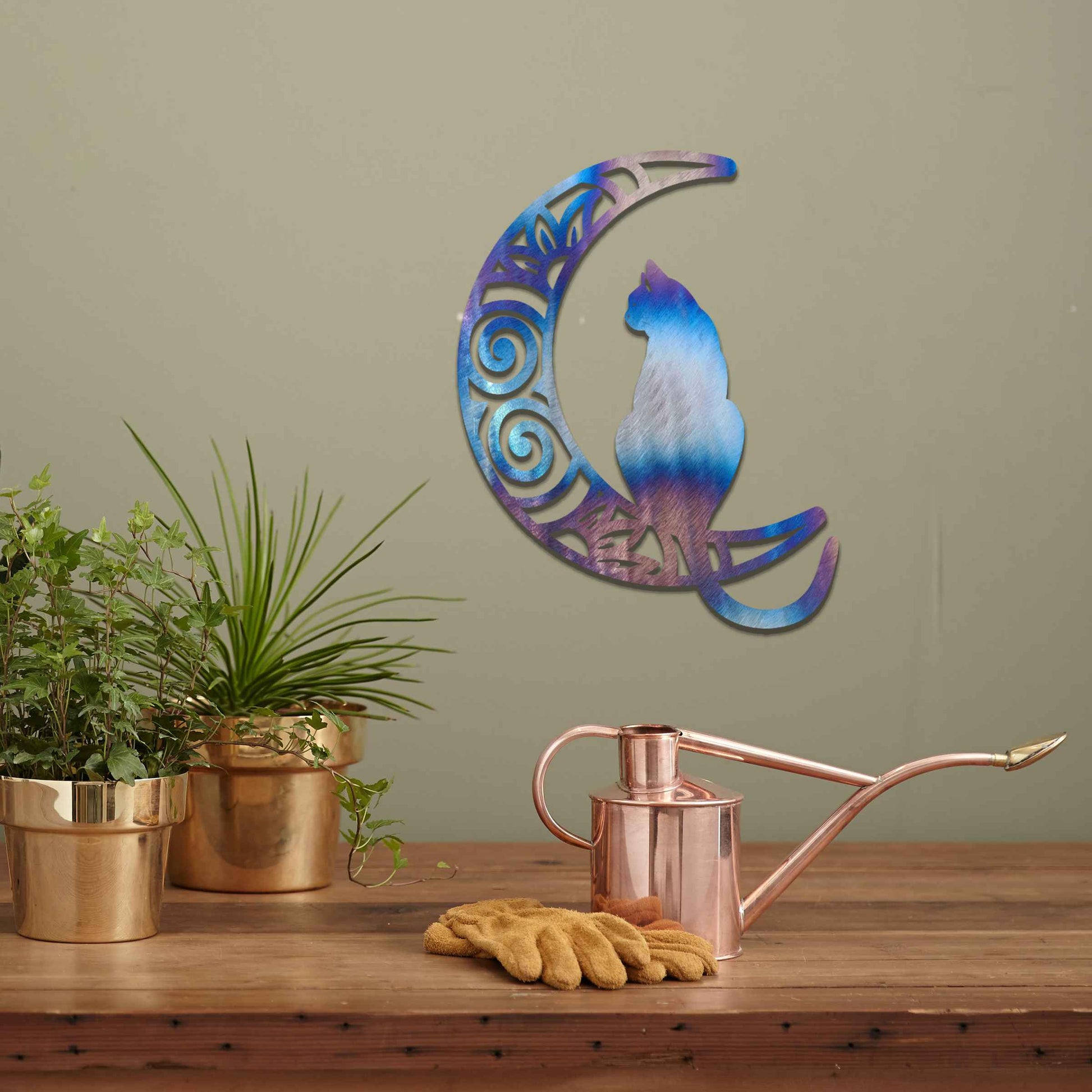 Metal garden decoration featuring a silhouette of a cat sitting on a crescent moon with intricate swirl and floral patterns, adding a mystical and elegant touch to outdoor or indoor walls.
