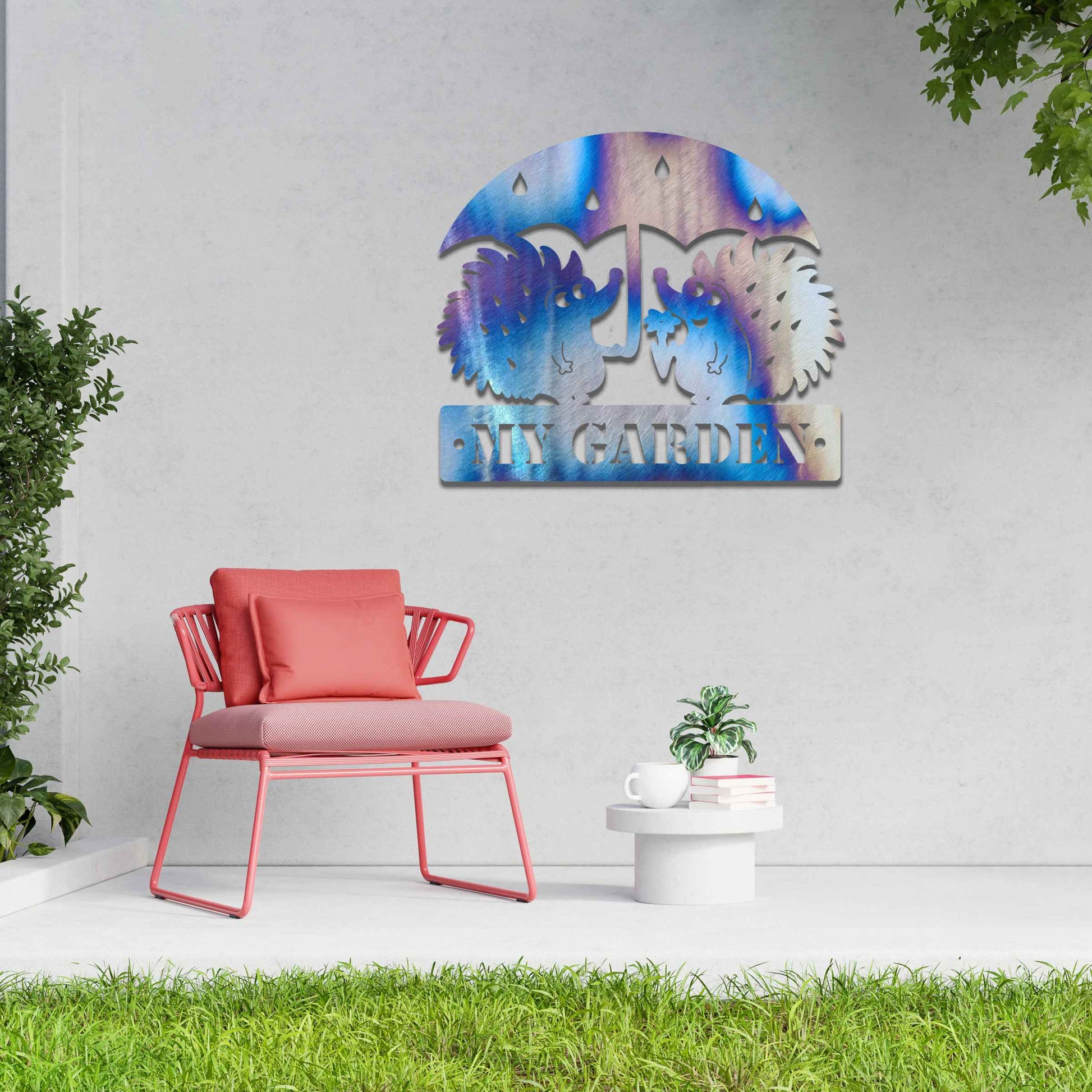 Metal garden decoration featuring two hedgehogs under an umbrella with raindrop details, accompanied by the word "Welcome," crafted with a rustic finish, adding a charming and inviting touch to outdoor spaces.