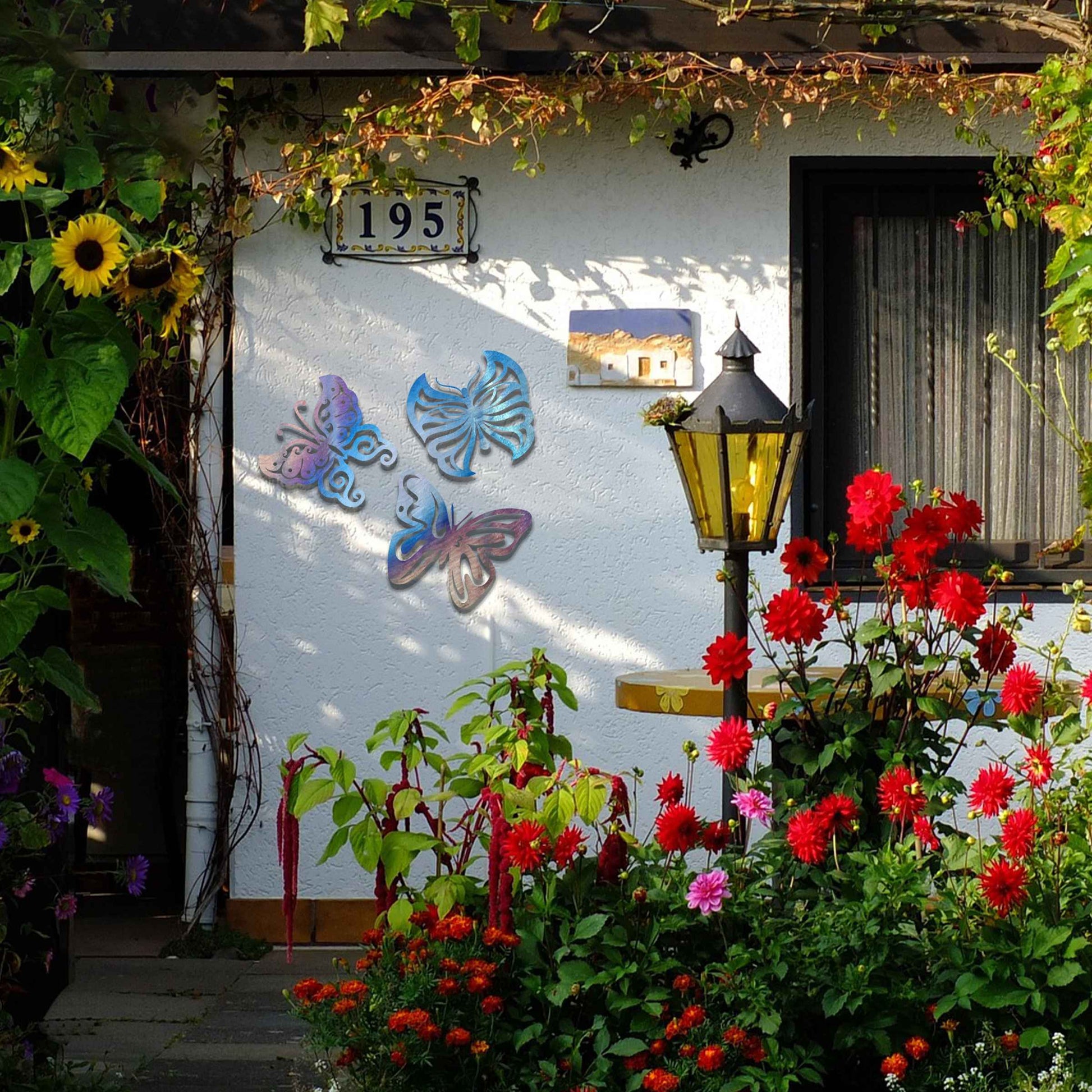 Set of metal garden decorations featuring three distinct butterfly designs with intricate patterns, adding a playful and nature-inspired charm to outdoor walls, fences, or garden spaces